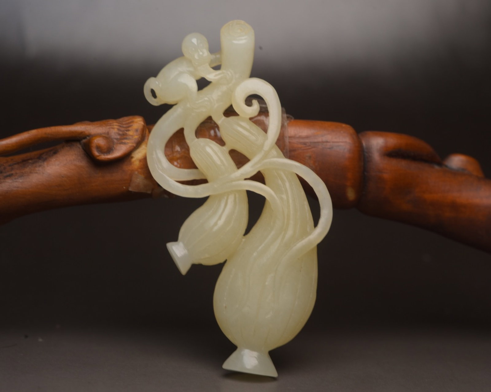 An Exquisite White Jade Monkey Pendant: An Exquisite White Jade Monkey Pendant,Qing Dynasty,China,Size:2.8inx1.3inx0.4in,Weight:22g 白玉猴子佩,中国清代