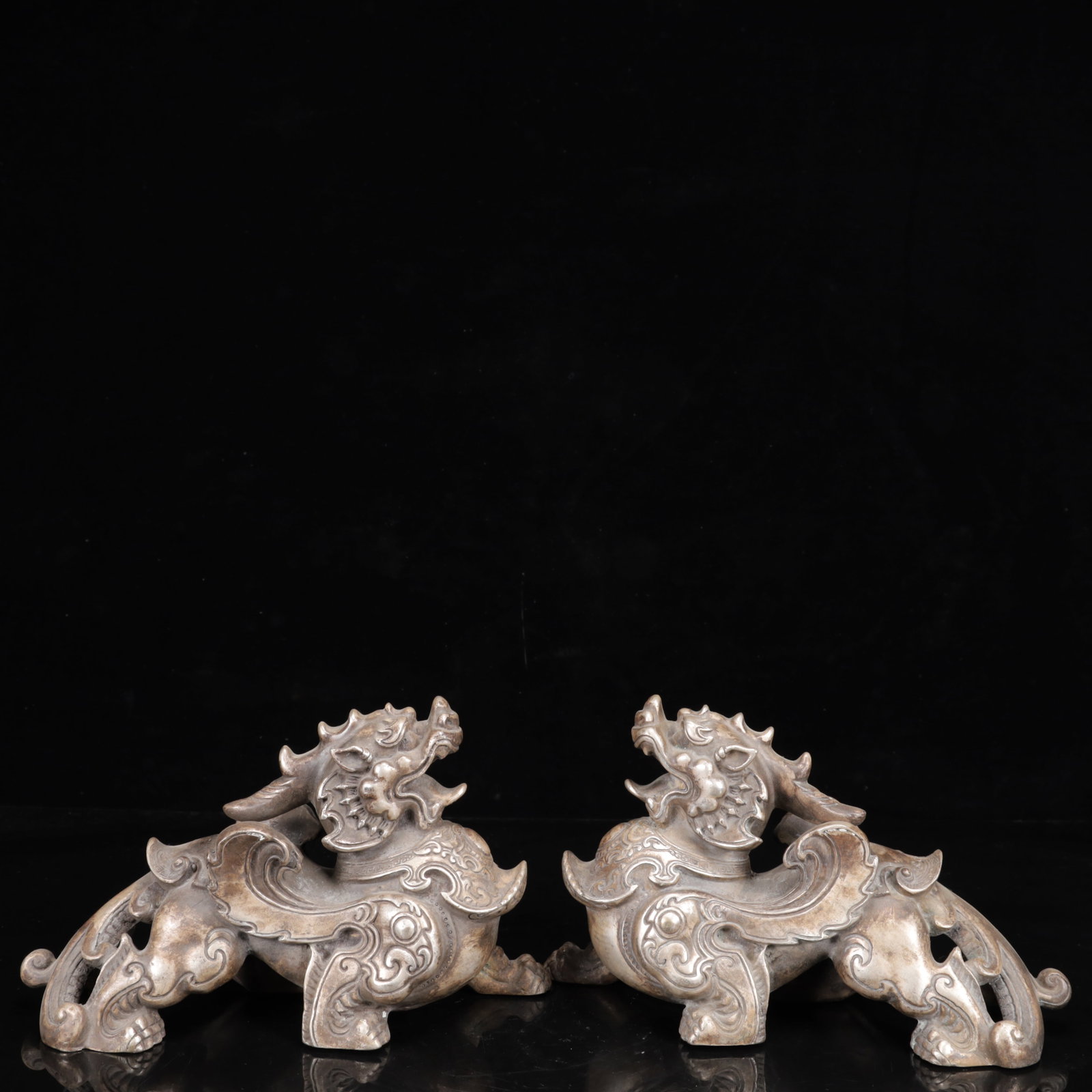 A Pair of Exquisite Silver-Plated Bronze Lion Ornaments: A Pair of Exquisite Silver-Plated Bronze Lion Ornaments,Qing Dynasty,China,Size:9.4inx3.5inx5.5in,Weight:3700g 一对铜镀银狮子摆件,中国