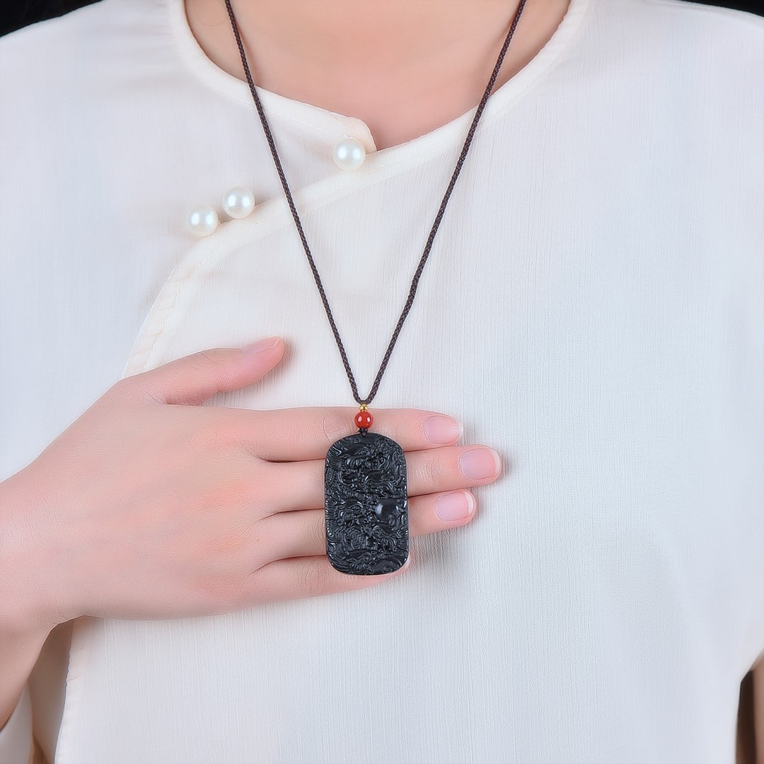 An Exquisite Black and White Jade Dragon Pattern Pendant (1 of 6)