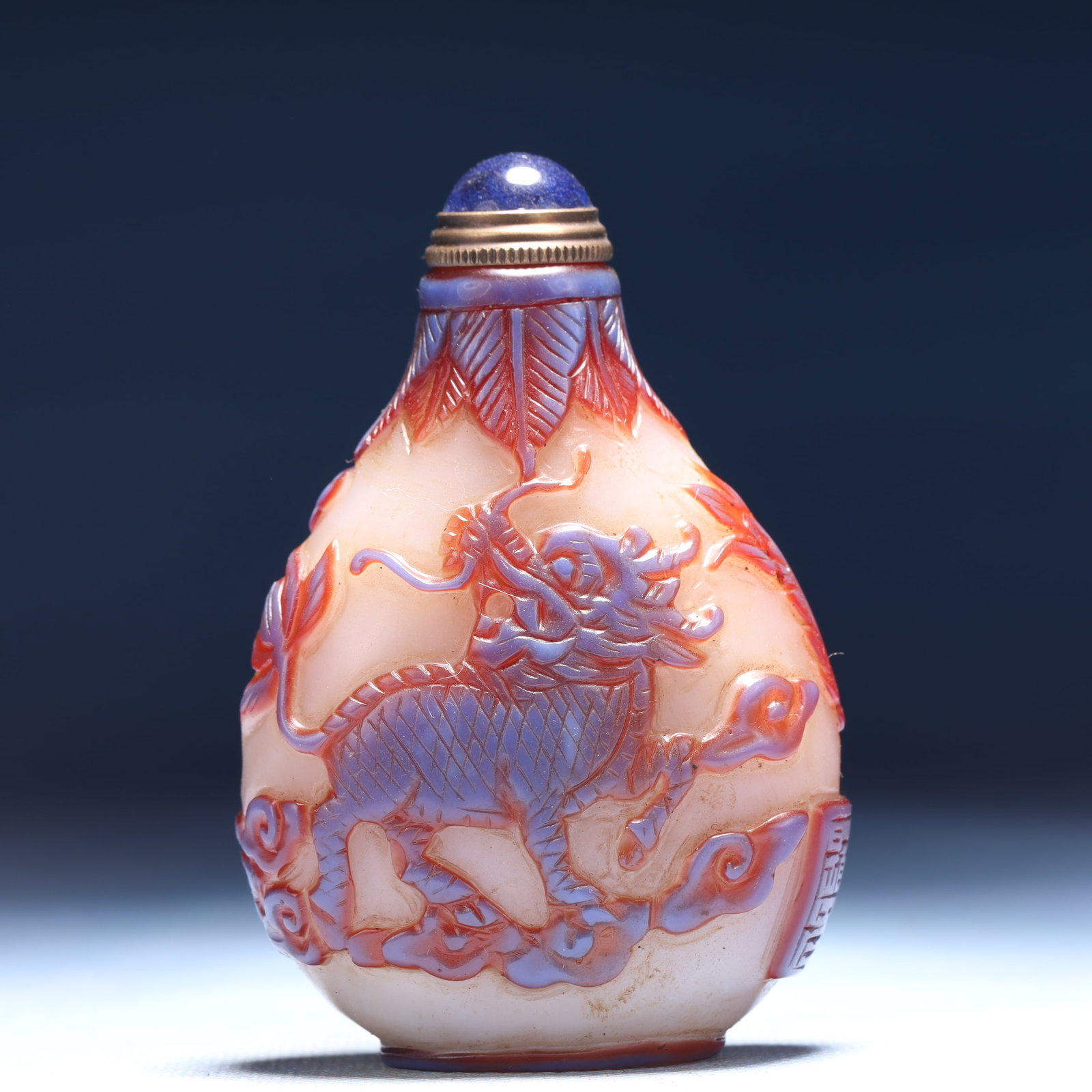 An Exquisite Glass Auspicious Cloud and Phoenix Pattern Snuff Bottle: An Exquisite Glass Auspicious Cloud and Phoenix Pattern Snuff Bottle,Qing Dynasty,China,Qianlong Four-character Mark,Size:2inx1.2inx3.1in,Weight:81g