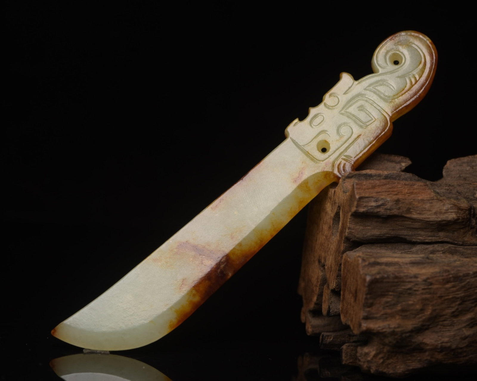 An Exquisite White Jade Beast-Face Pattern Sword: An Exquisite White Jade Beast-Face Pattern Sword,Qing Dynasty,China,Size:5.2inx0.9inx0.2in,Weight:39g 白玉兽面纹刀,中国清代