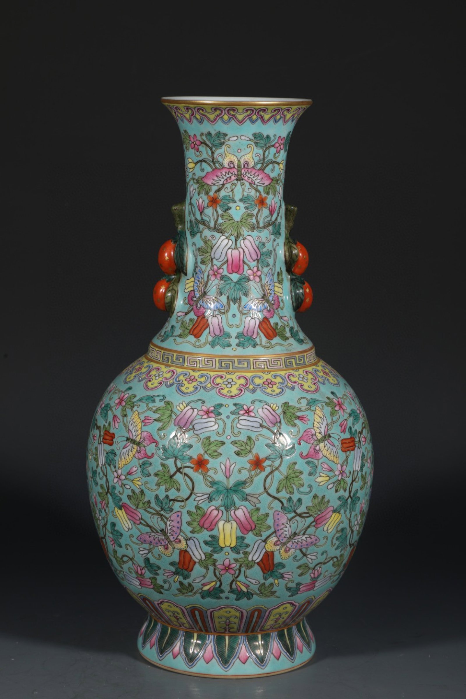 An Exquisite Turquoise Glazed Famille-Rose Flower and Butterfly Pattern Double-Ears Vase: An Exquisite Turquoise Glazed Famille-Rose Flower and Butterfly Pattern Double-Ears Vase,Qing Dynasty,China,Qianlong Six-character Mark,Size:13.3inx7.1in 松石绿釉粉ঊ