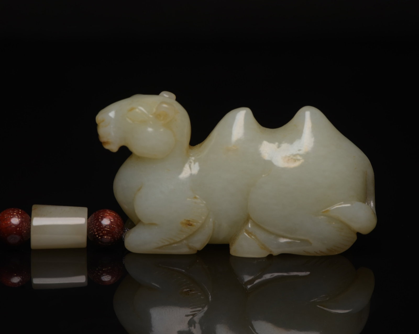 An Exquisite White Jade Camel Ornament: An Exquisite White Jade Camel Ornament,Qing Dynasty,China,Size:2.4inx1.3inx0.7in,Weight:61g 白玉骆驼摆件,中国清代