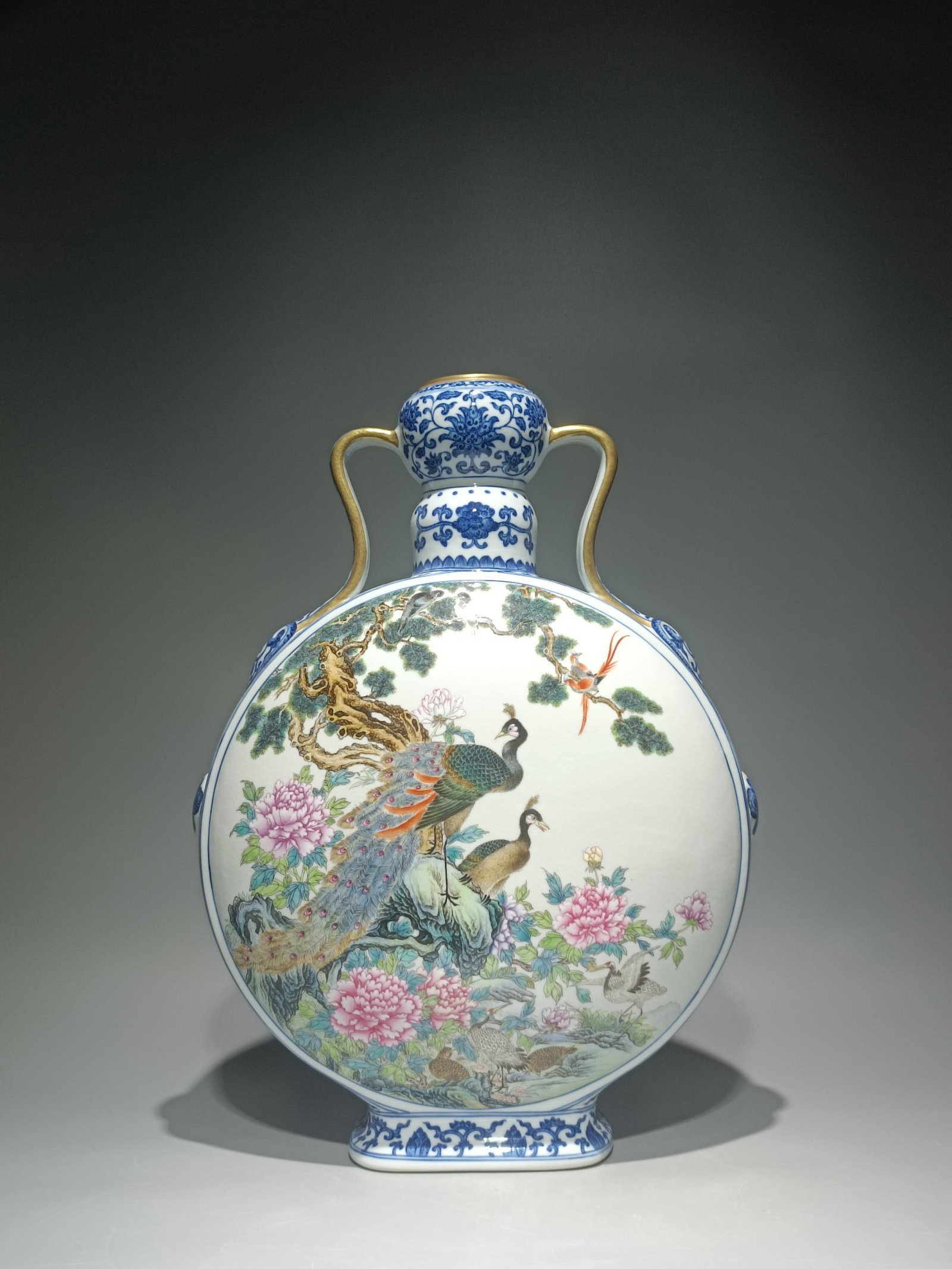 An Exquisite Blue and White Famille-Rose Flower and Peacock Pattern Double-Ears Vase: An Exquisite Blue and White Famille-Rose Flower and Peacock Pattern Double-Ears Vase,Qing Dynasty,China,Qianlong Six-character Mark,Size:16.5inx12.2in