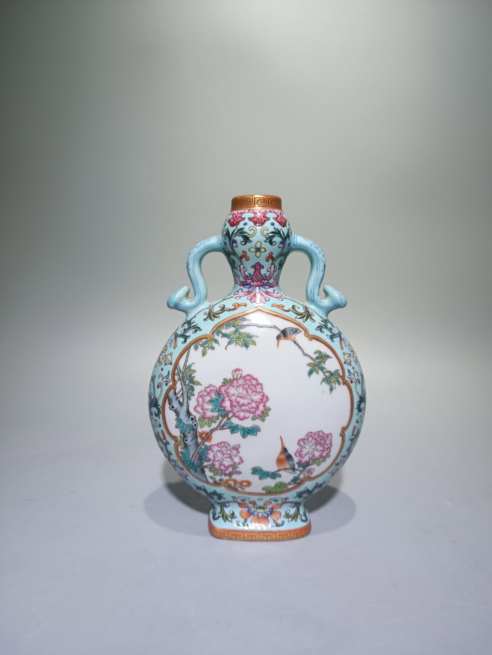 An Exquisite Famille-Rose Turquoise Glazed Flower and Bird Pattern Double-Ears Vase: An Exquisite Famille-Rose Turquoise Glazed Flower and Bird Pattern Double-Ears Vase,Qing Dynasty,China,Qianlong Four-character Mark,Size:7.5inx4.9in 粉彩松石绿釉