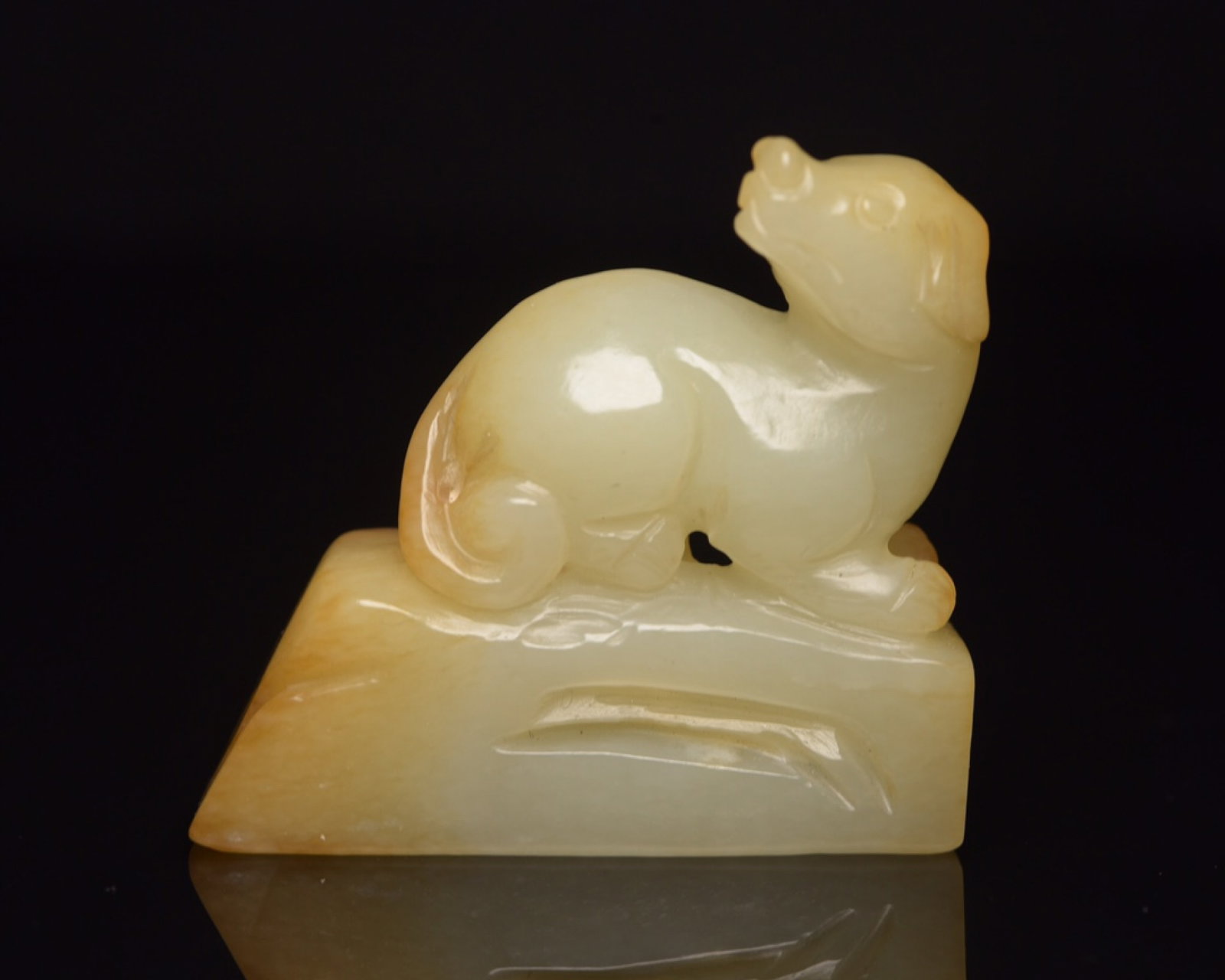 An Exquisite White Jade Dog Ornament: An Exquisite White Jade Dog Ornament,Qing Dynasty,China,Size:2.1inx2inx0.8in,Weight:77g 白玉犬摆件,中国清代