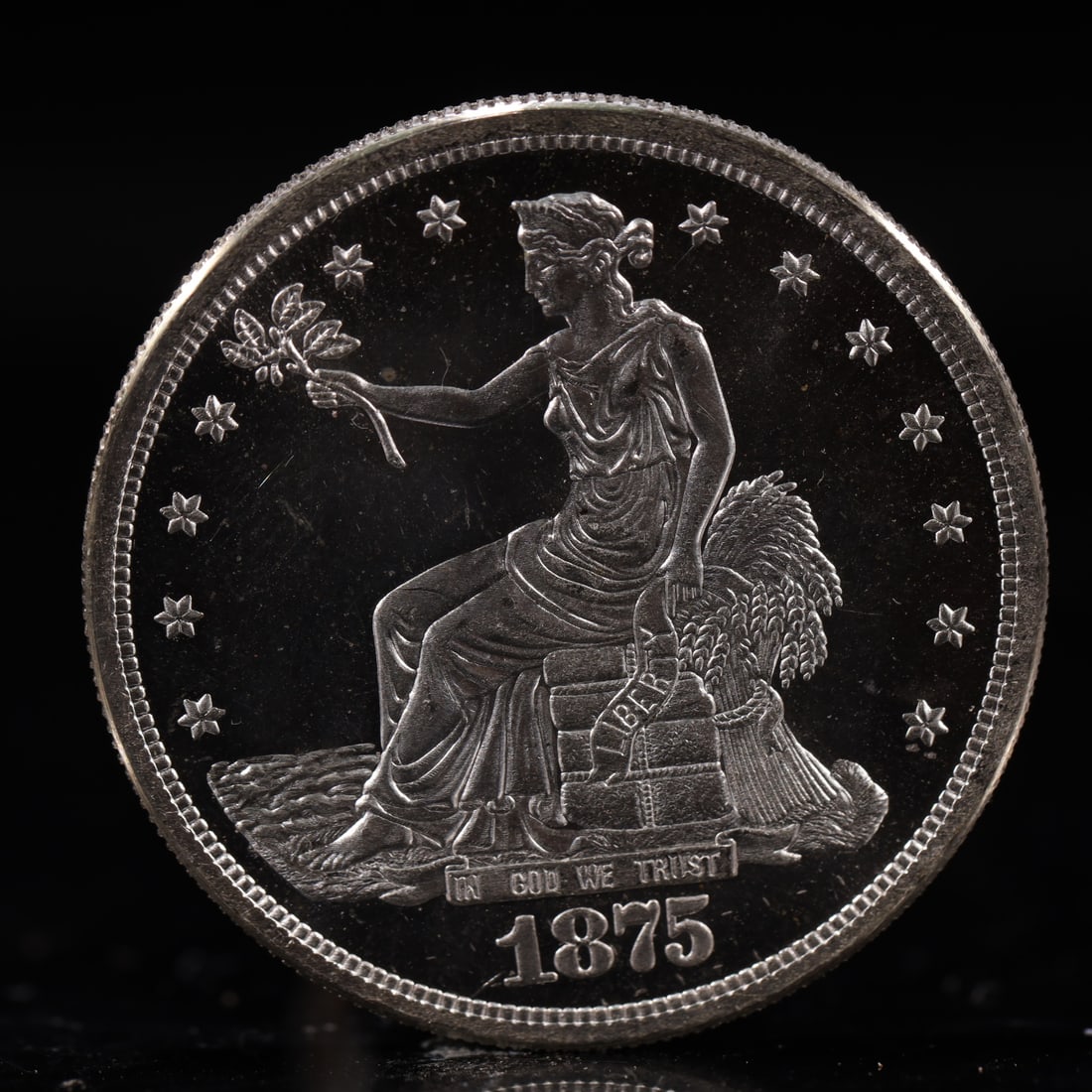 USA Trade Dollar 1875 Coin: American coin. Obverse: Liberty seated on a pedestal facing the sea to the left holding olive branches surrounded by 13 stars. IN GOD WE TRUST / LIBERTY / 1875. Reverse: An eagle holding branches