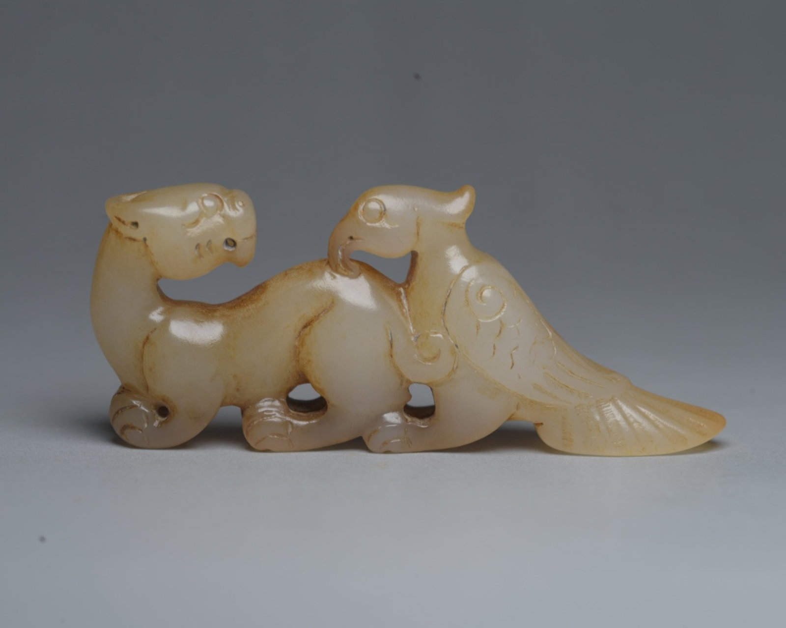 An Exquisite White Jade Dragon and Phoenix Ornament: An Exquisite White Jade Dragon and Phoenix Ornament,Qing Dynasty,China,Size:3inx1.2inx0.5in,Weight:39g 白玉龙凤摆件,中国清代