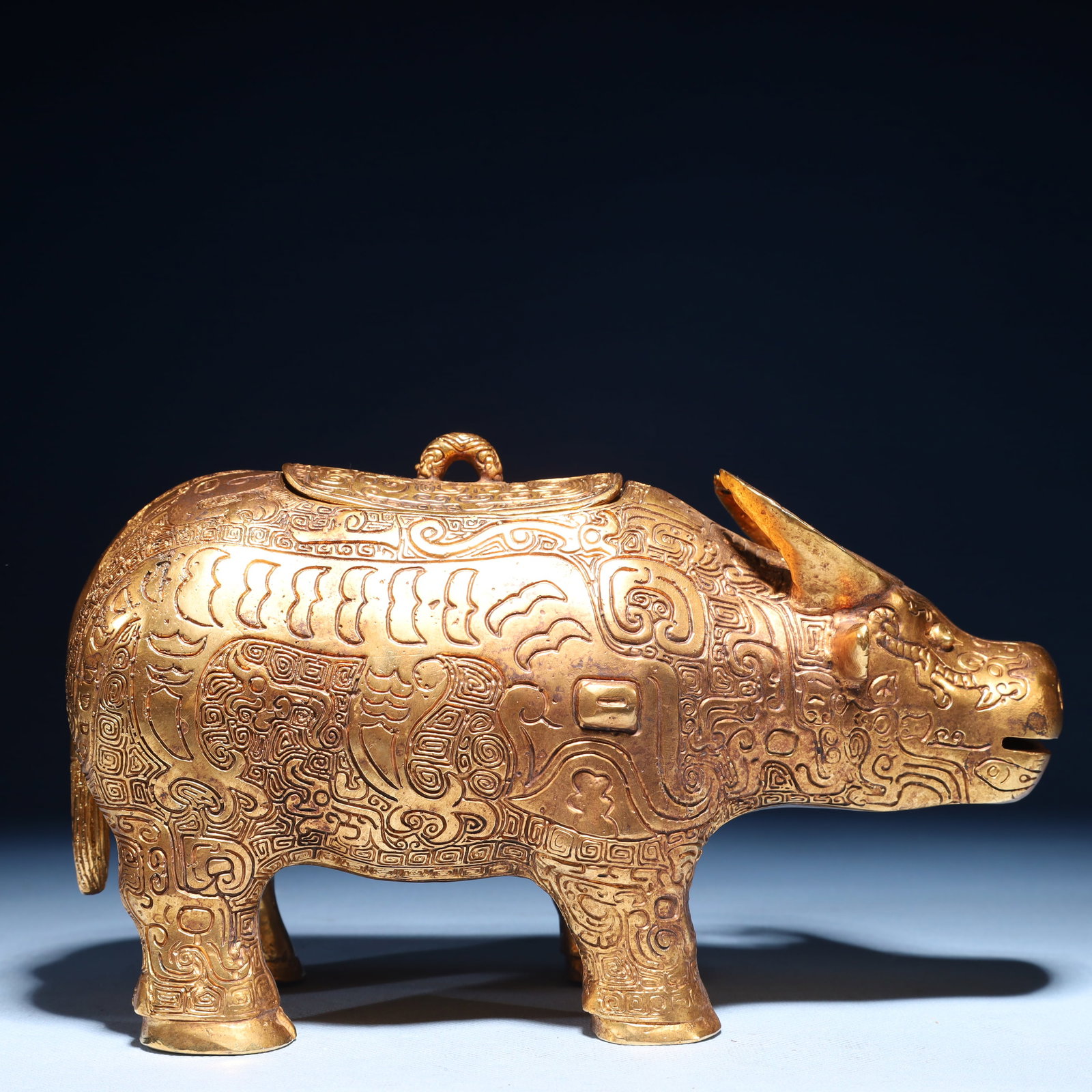 An Exquisite Gilt Bronze Chi-Dragon Pattern Buffalo Ornament: An Exquisite Gilt Bronze Chi-Dragon Pattern Buffalo Ornament,Qing Dynasty,China,Size:9.4inx4.3inx5.5in,Weight:2000g 铜鎏金螭龙纹牛摆件,中