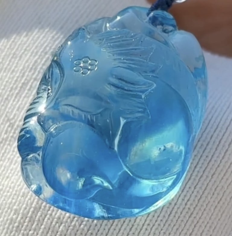 An Exquisite Aquamarine Auspicious Beast Necklace: An Exquisite Aquamarine Auspicious Beast Necklace,Size:37mmx27mmx20mm,Weight:26.8g 海蓝宝瑞兽吊坠