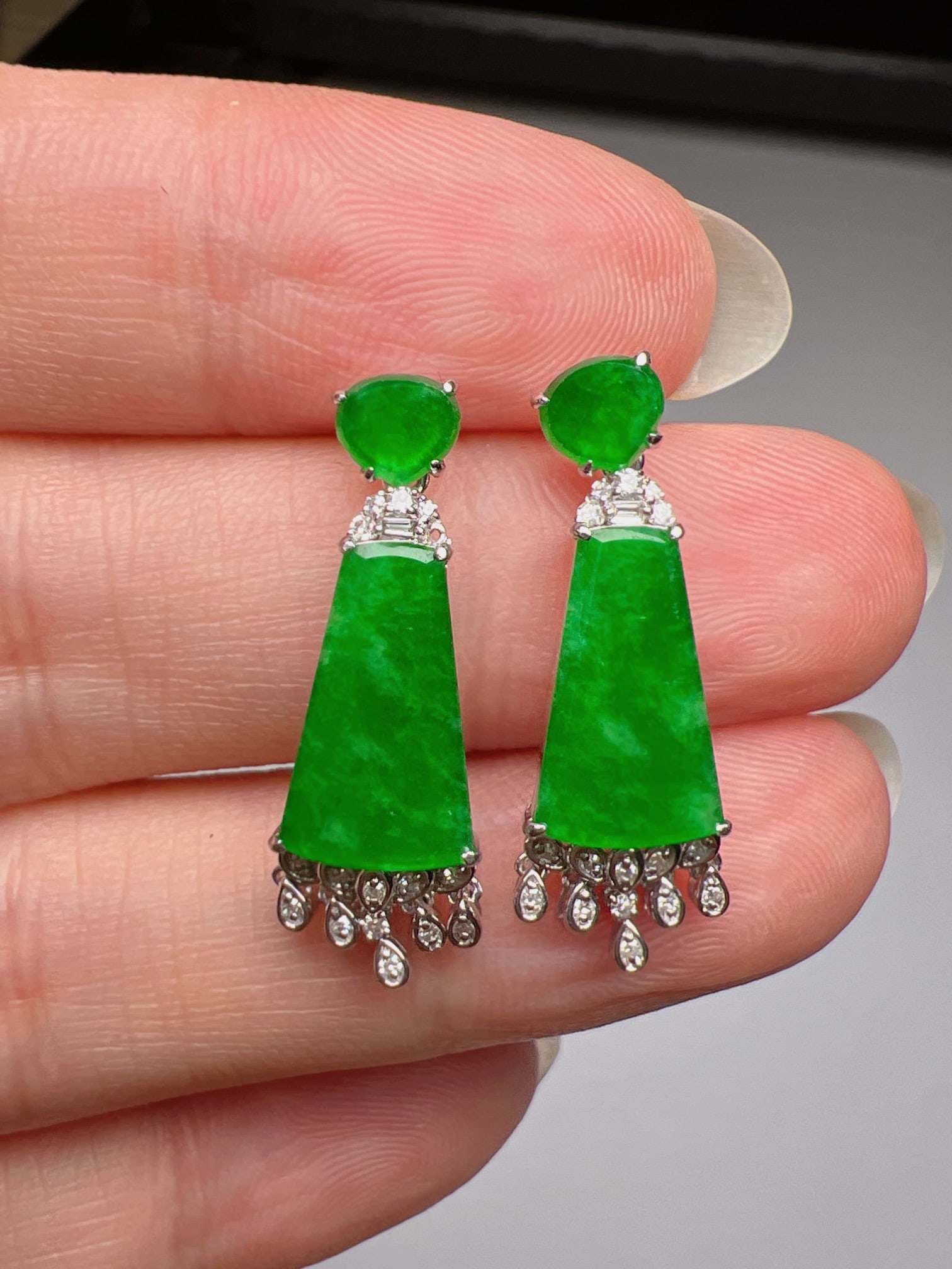 A Pair of Exquisite 18k Gold Diamond Inlaid Jadeite Earrings: A Pair of Exquisite 18k Gold Diamond Inlaid Jadeite Earrings,Size(Loose Stone):12.5mmx8.1mm 一对18k金钻镶嵌翡翠耳环