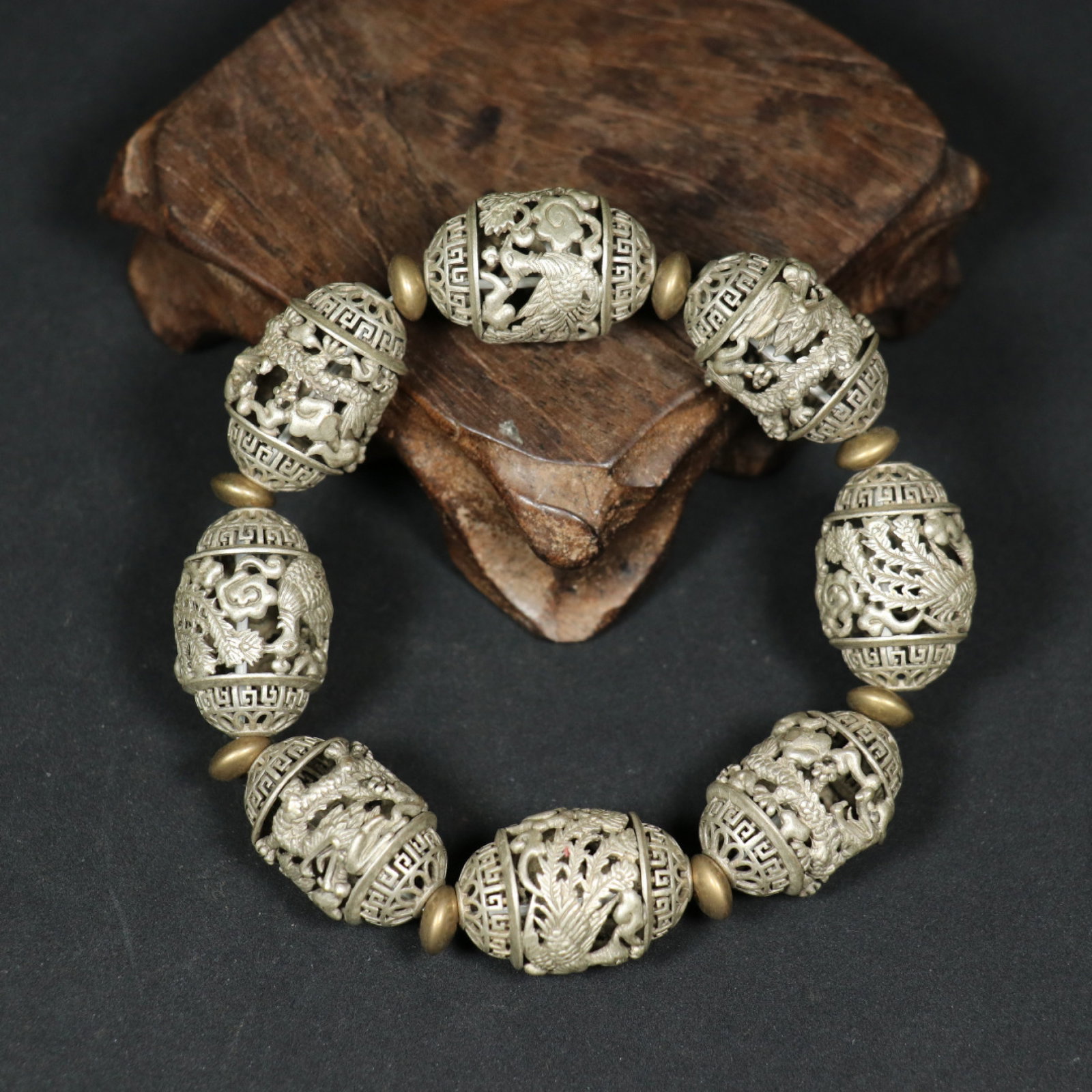 An Exquisite Silver Dragon and Phoenix Pattern Bracelet: An Exquisite Silver Dragon and Phoenix Pattern Bracelet,Qing Dynasty,China,Size:1inx0.7in,Weight:60.5g 银龙凤纹手链,中国清代