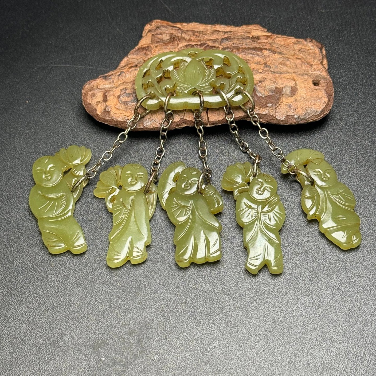 An Exquisite Yellow Jade Figure Pendant: An Exquisite Yellow Jade Figure Pendant,Qing Dynasty,China,Size:(Lotus)43mmx25mmx5mm,(Figure)41mmx22mmx5mm*5,Weight:49g 黄玉人物挂件,中国清代