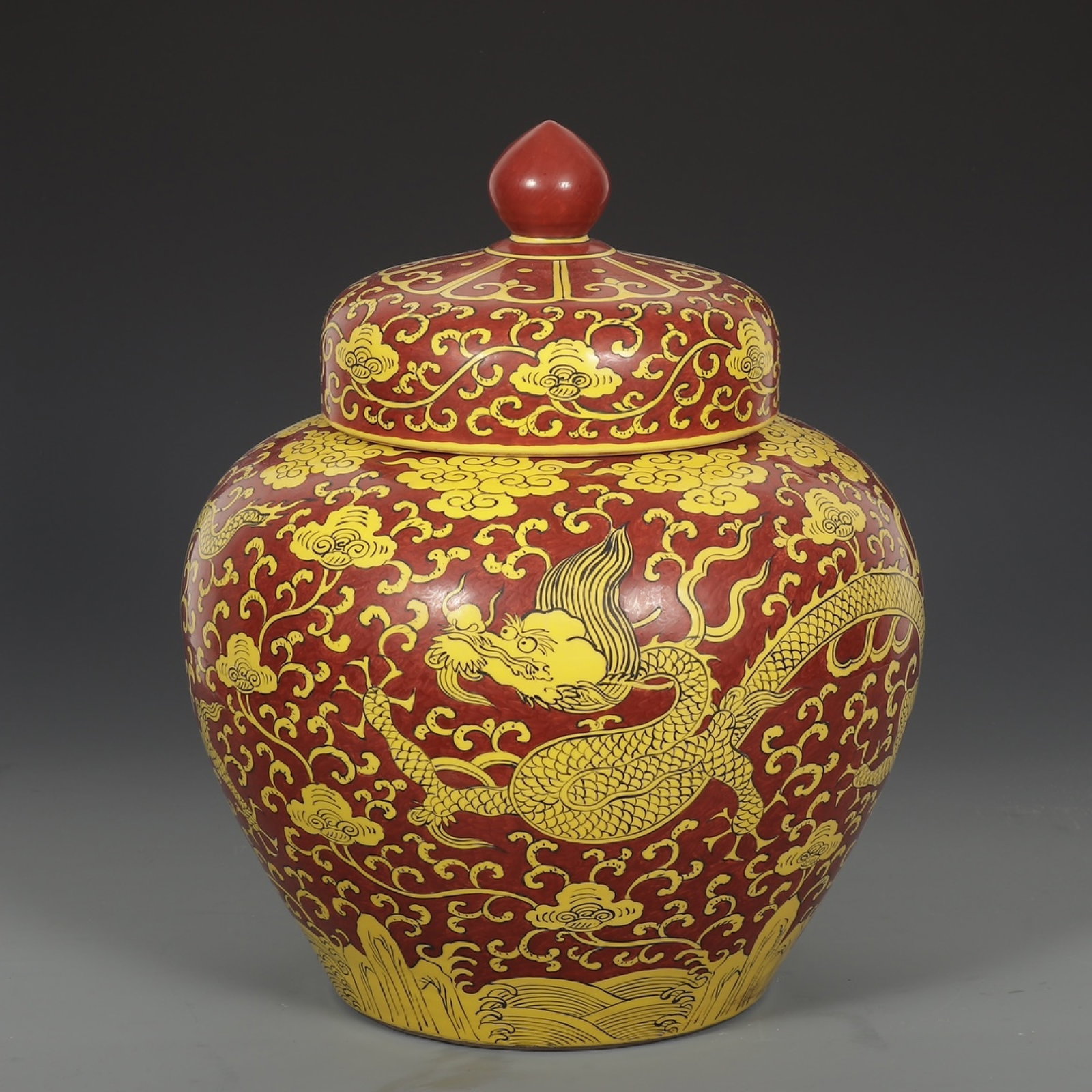 An Exquisite Red Ground Yellow Color Seawater and Dragon Pattern Jar with Cover: An Exquisite Red Ground Yellow Color Seawater and Dragon Pattern Jar with Cover,Ming Dynasty,China,Jiajing Six-Character Mark,Size:16.7inx13.4in 红地黄彩海水龙