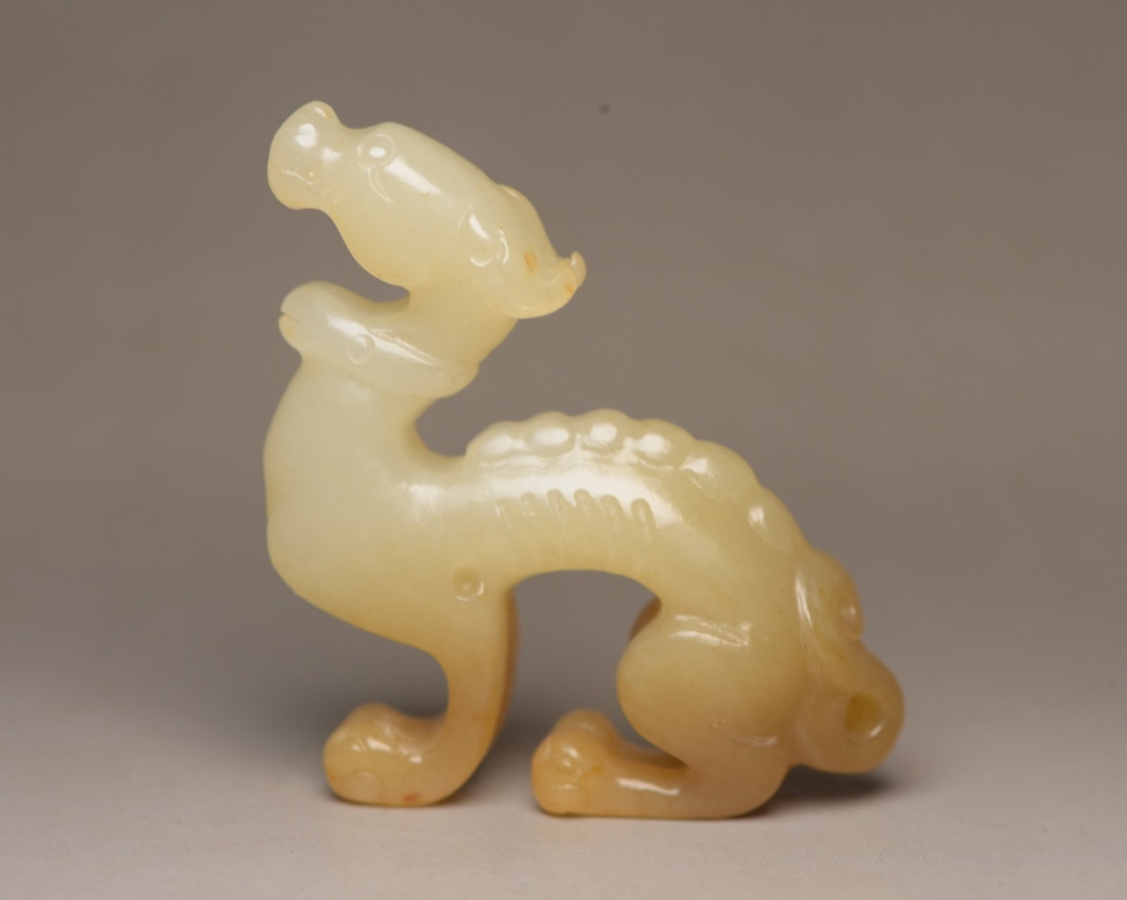 An Exquisite White Jade Dog Ornament: An Exquisite White Jade Dog Ornament,Qing Dynasty,China,Size:2inx2inx0.5in,Weight:29g 白玉犬摆件,中国清代