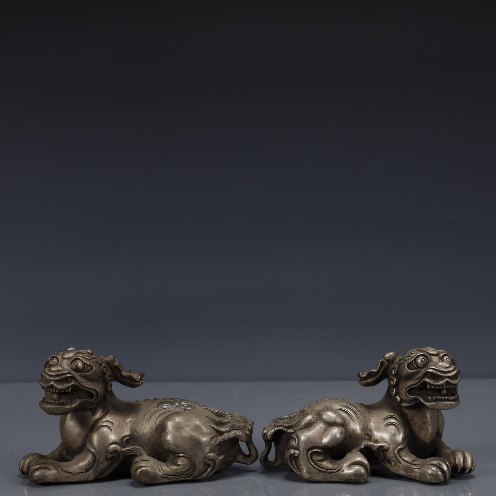 A Pair of Exquisite Silver-Plated Bronze Auspicious Beast Ornament: A Pair of Exquisite Silver-Plated Bronze Auspicious Beast Ornament,The Republic of China,Size:4.7inx2.4inx2.4in,Weight:1350g