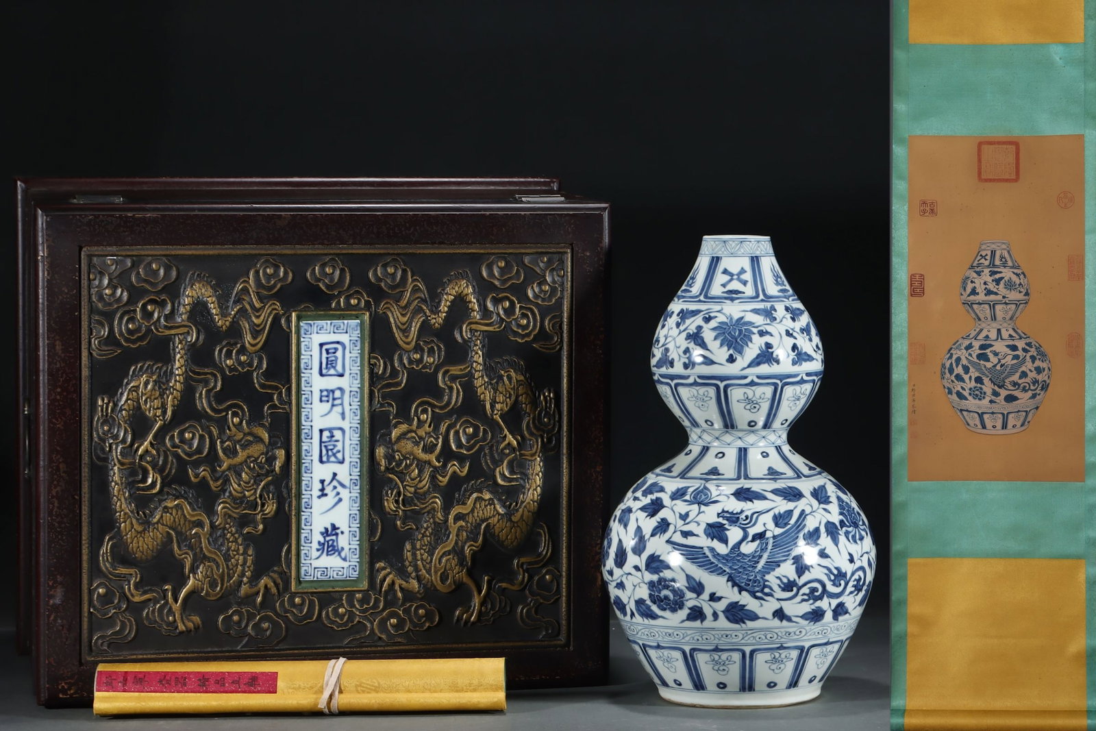 A Huge Blue and White Lotus and Phoenix Pattern Gourd-Shaped Vase,with Chinese Vertical Scroll Ink: A Huge Blue and White Lotus and Phoenix Pattern Gourd-Shaped Vase,with Chinese Vertical Scroll Ink Painting on Silk,Yuan Dynasty,China,Size:(Porcelain)17.4inx10.4in,(Without frame)24.8inx12.6in ༡