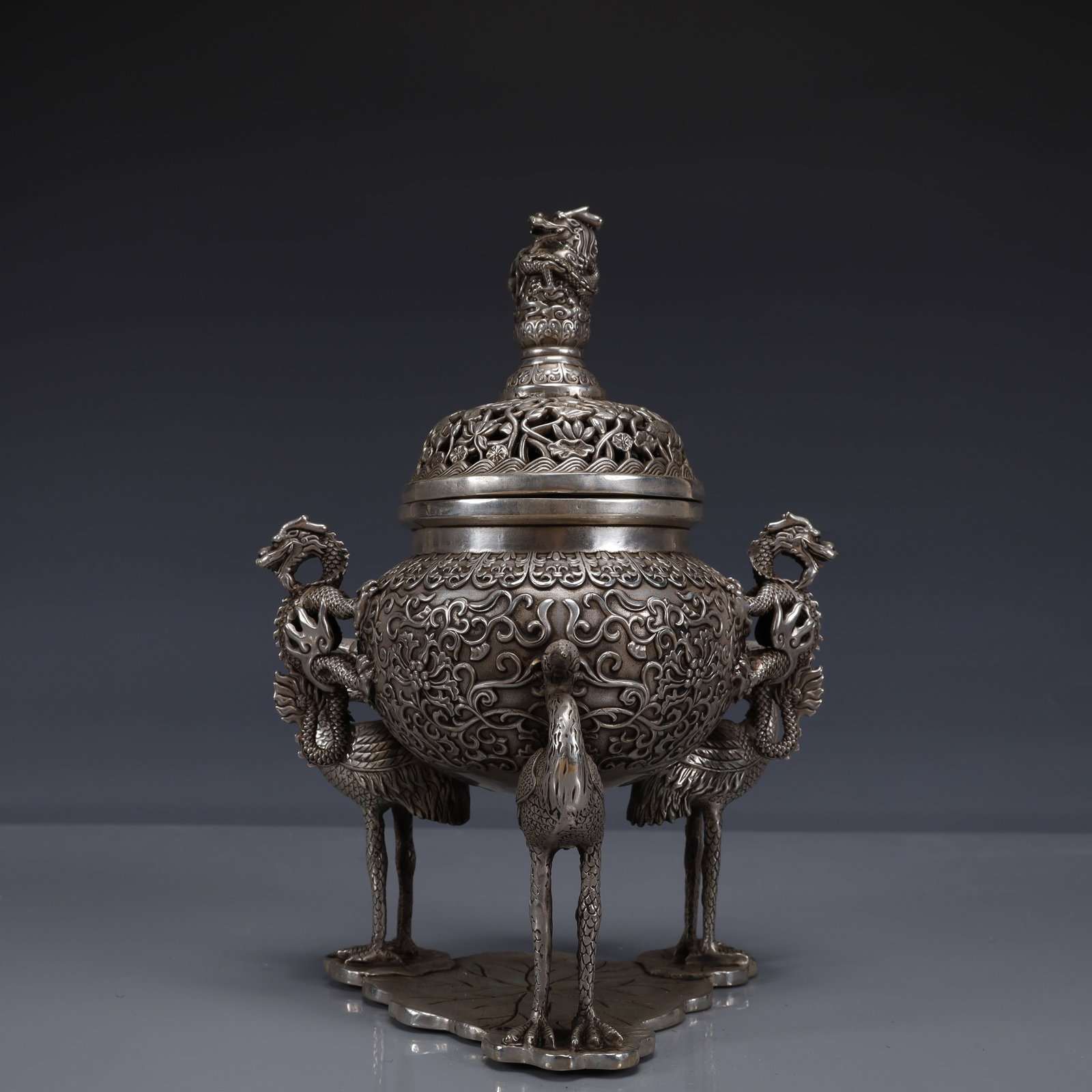 An Exquisite Silver-Plated Bronze Lotus Pattern Dragon-Ears Crane-Legs Censer: An Exquisite Silver-Plated Bronze Lotus Pattern Dragon-Ears Crane-Legs Censer,Ming Dynasty, China,Xuande Six-character Mark,Size:7.5inx5.5inx9.8in,Weight:1950g 铜镀银缠枝