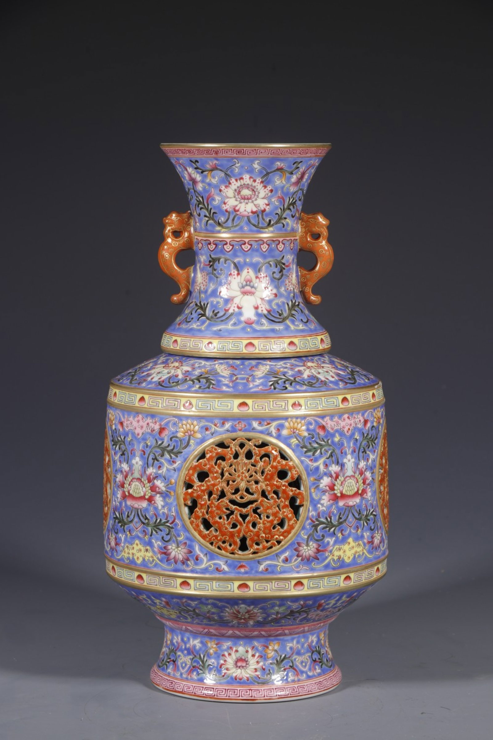 An Exquisite Blue Ground Enamel Lotus Pattern Double-Ears Vase: An Exquisite Blue Ground Enamel Lotus Pattern Double-Ears Vase,Qing Dynasty,China,Qianlong Four-character Mark,Size:11.8inx3.9in 蓝地珐琅彩缠枝莲纹
