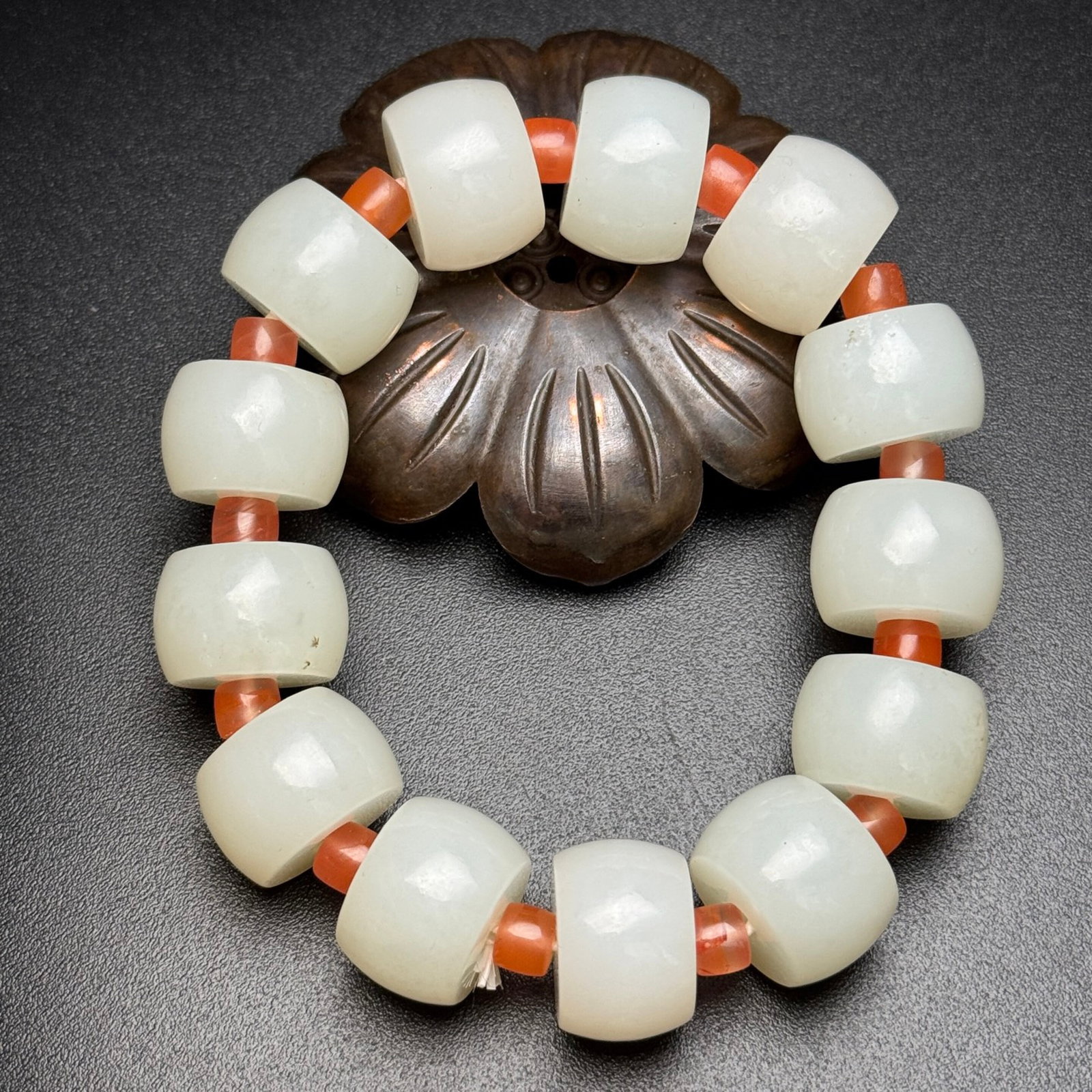 An Exquisite White Jade Bracelet: An Exquisite White Jade Bracelet,Qing Dynasty,China,Size:17.5mmx12mm,Weight:103g 白玉手串,中国清代