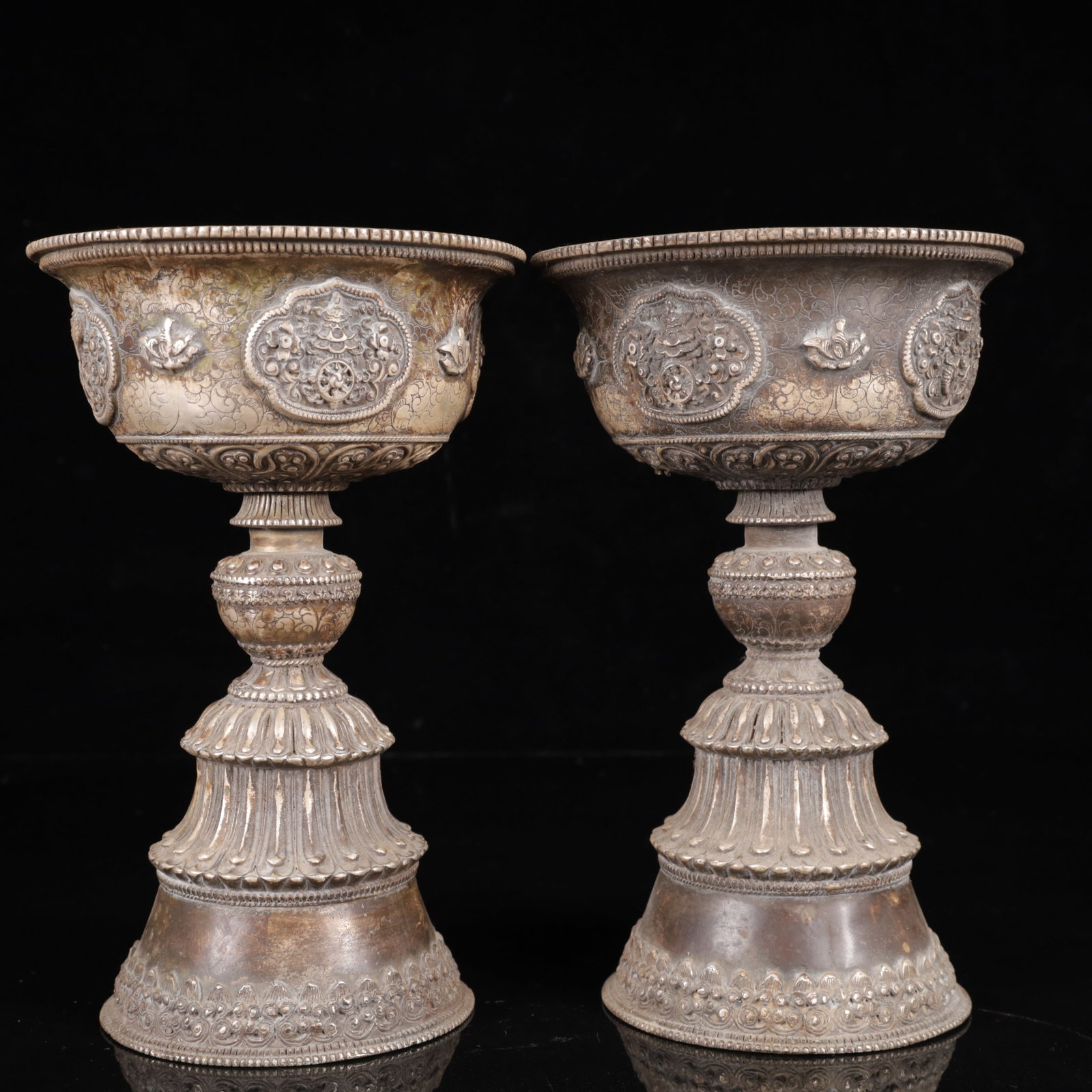 A Pair of Exquisite Silver-Plated Bronze Lotus Pattern Candlesticks: A Pair of Exquisite Silver-Plated Bronze Lotus Pattern Candlesticks,Qing Dynasty,China,Size:5.5inx8.7in,Weight:2250g 一对铜镀银缠枝莲纹烛