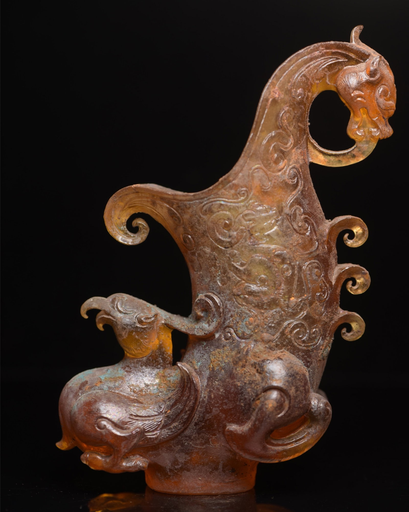 An Exquisite Glass Dragon and Phoenix Pattern Goblet: An Exquisite Glass Dragon and Phoenix Pattern Goblet,Qing Dynasty,China,Size:5.9inx5.8inx3.2in,Weight:1126g 琉璃龙凤纹爵杯,中国清代