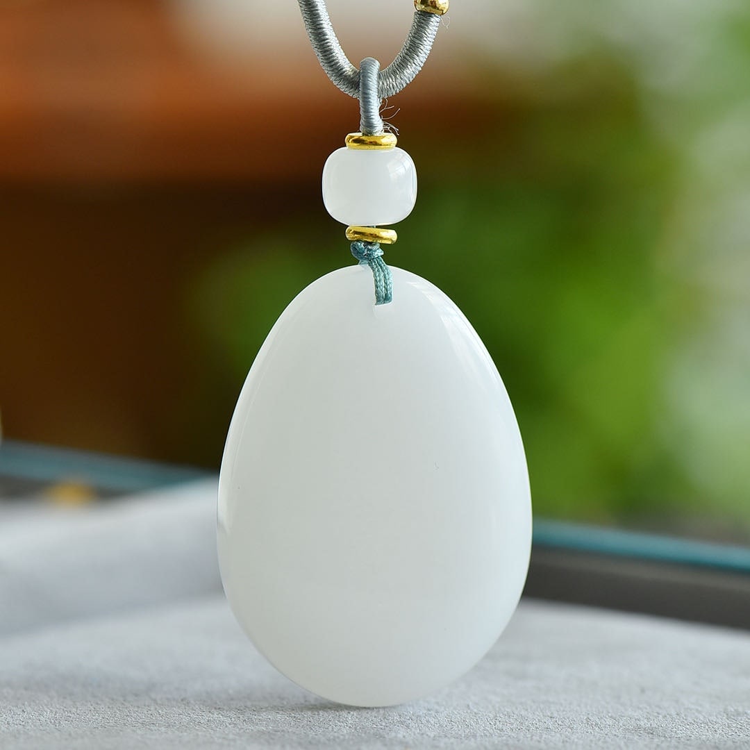 An Exquisite White Jade Pendant: An Exquisite White Jade Pendant,Size:26mm 白玉挂件