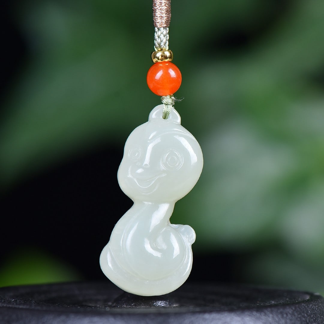 An Exquisite White Jade Snake Pendant: An Exquisite White Jade Snake Pendant,Size:17mmx34mm 白玉蛇挂件