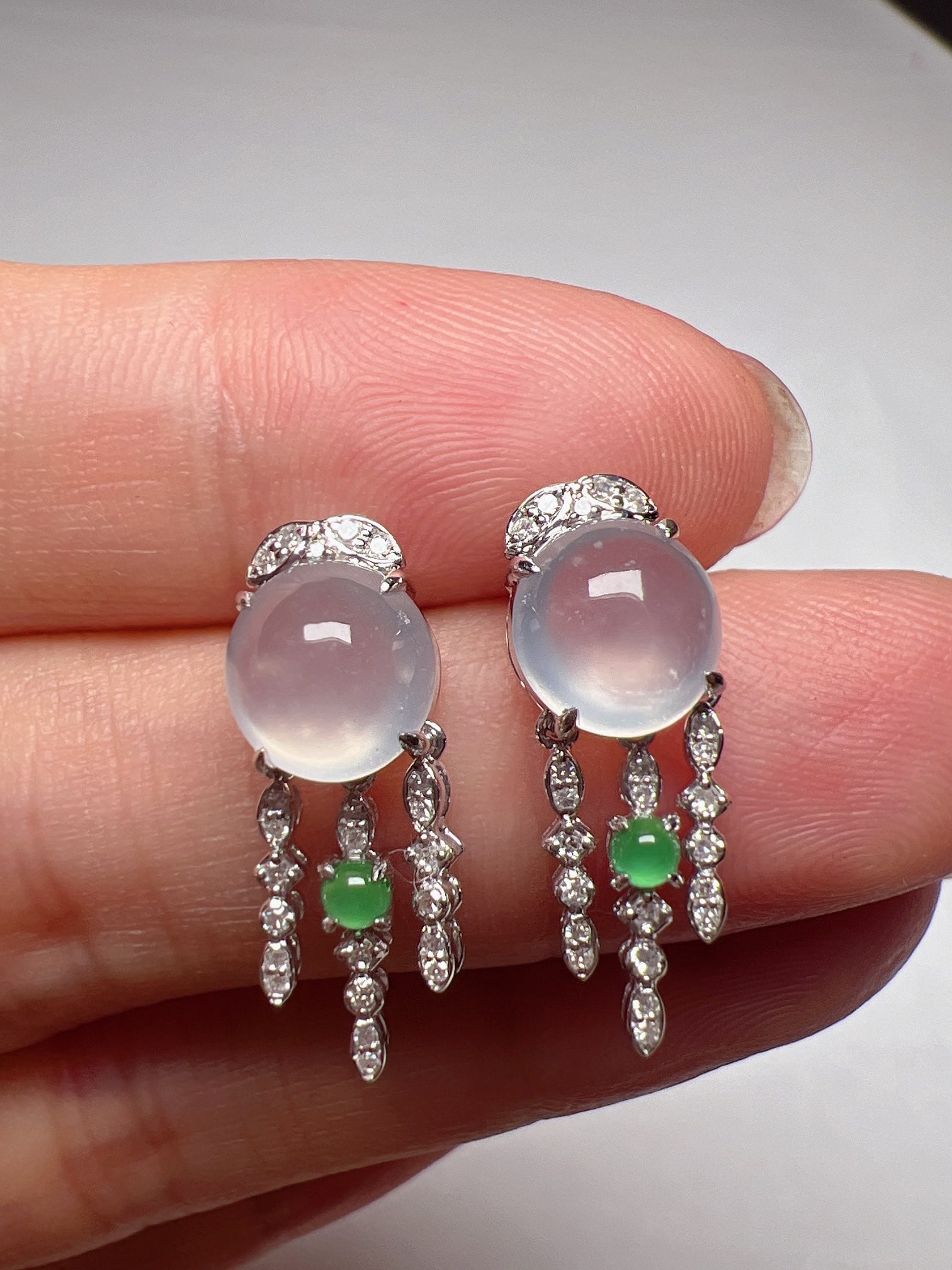 A Pair of Exquisite 18k Gold Diamond Inlaid Jadeite Earrings: A Pair of Exquisite 18k Gold Diamond Inlaid Jadeite Earrings,Size(Loose Stone):7.2mmx7mm 一对18k金钻镶嵌翡翠耳环