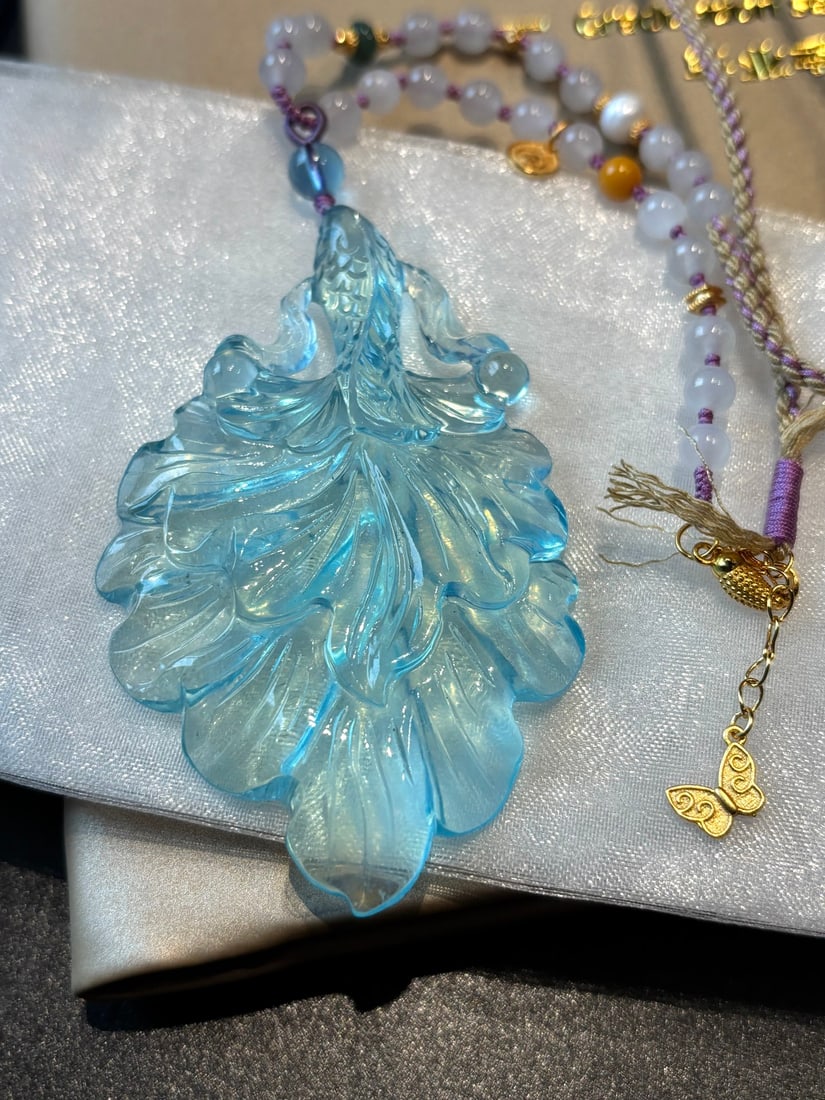 An Exquisite Aquamarine Fish Pattern Pendant: An Exquisite Aquamarine Fish Pattern Pendant,Size:69mmx45mmx9.2mm,Weight:33.7g 海蓝宝鱼纹挂件