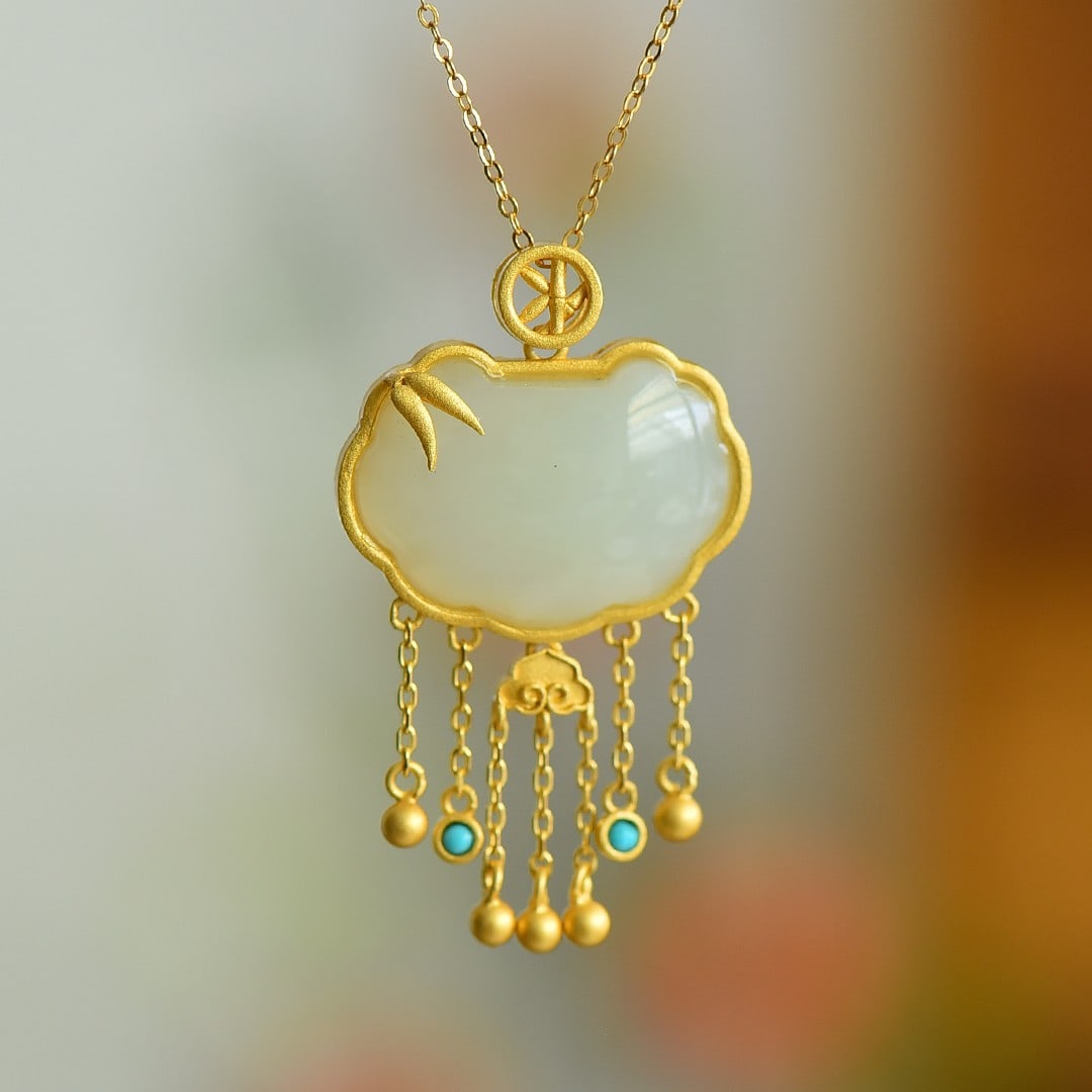 An Exquisite Sterling Silver-Gold Plated Inlaid White Jade Pendant: An Exquisite Sterling Silver-Gold Plated Inlaid White Jade Pendant 纯银镀金镶白玉吊坠