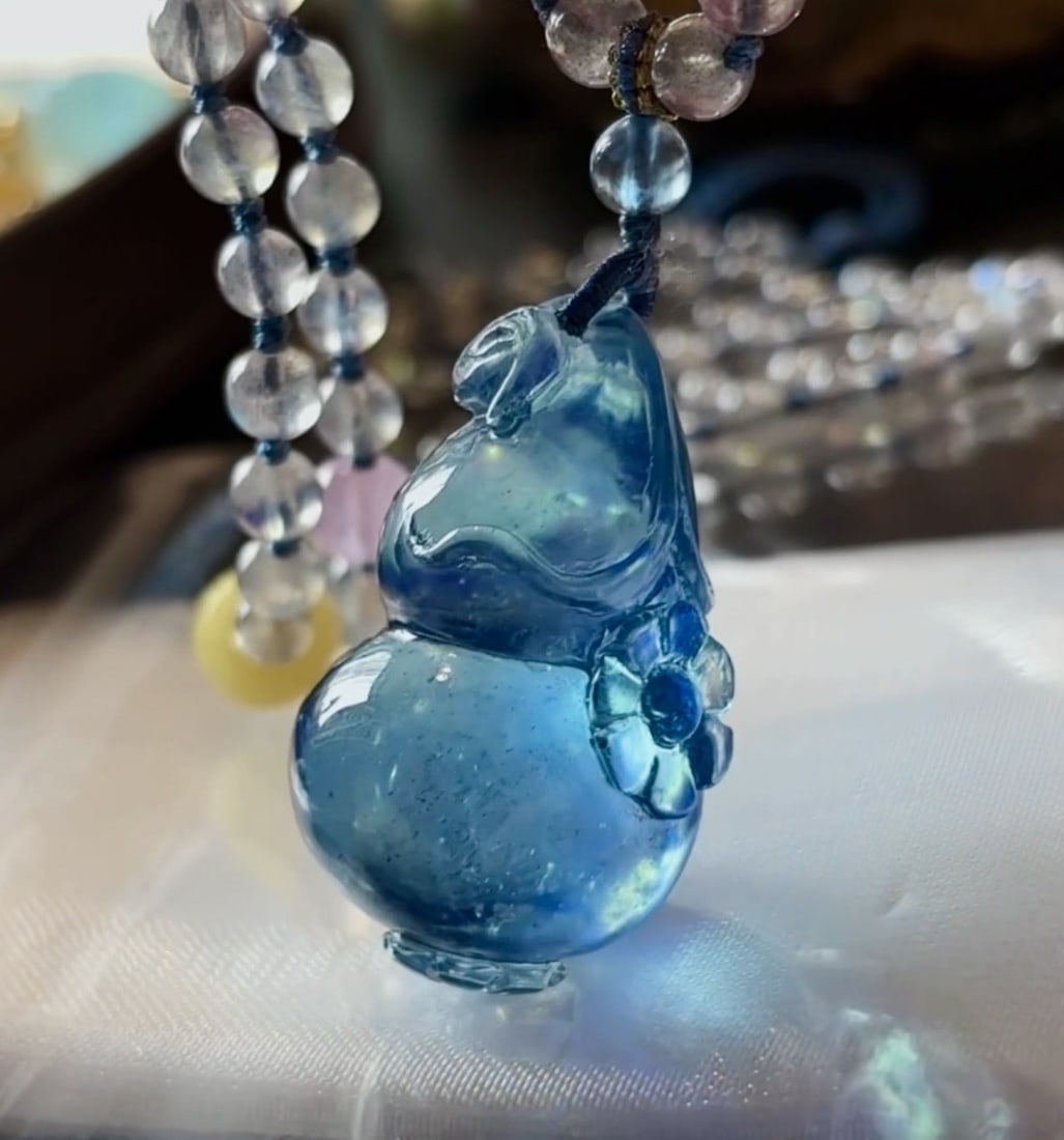 An Exquisite Aquamarine Gourd Necklace: An Exquisite Aquamarine Gourd Necklace,Size:35mmx22mmx19mm,Weight:32g 海蓝宝葫芦项链