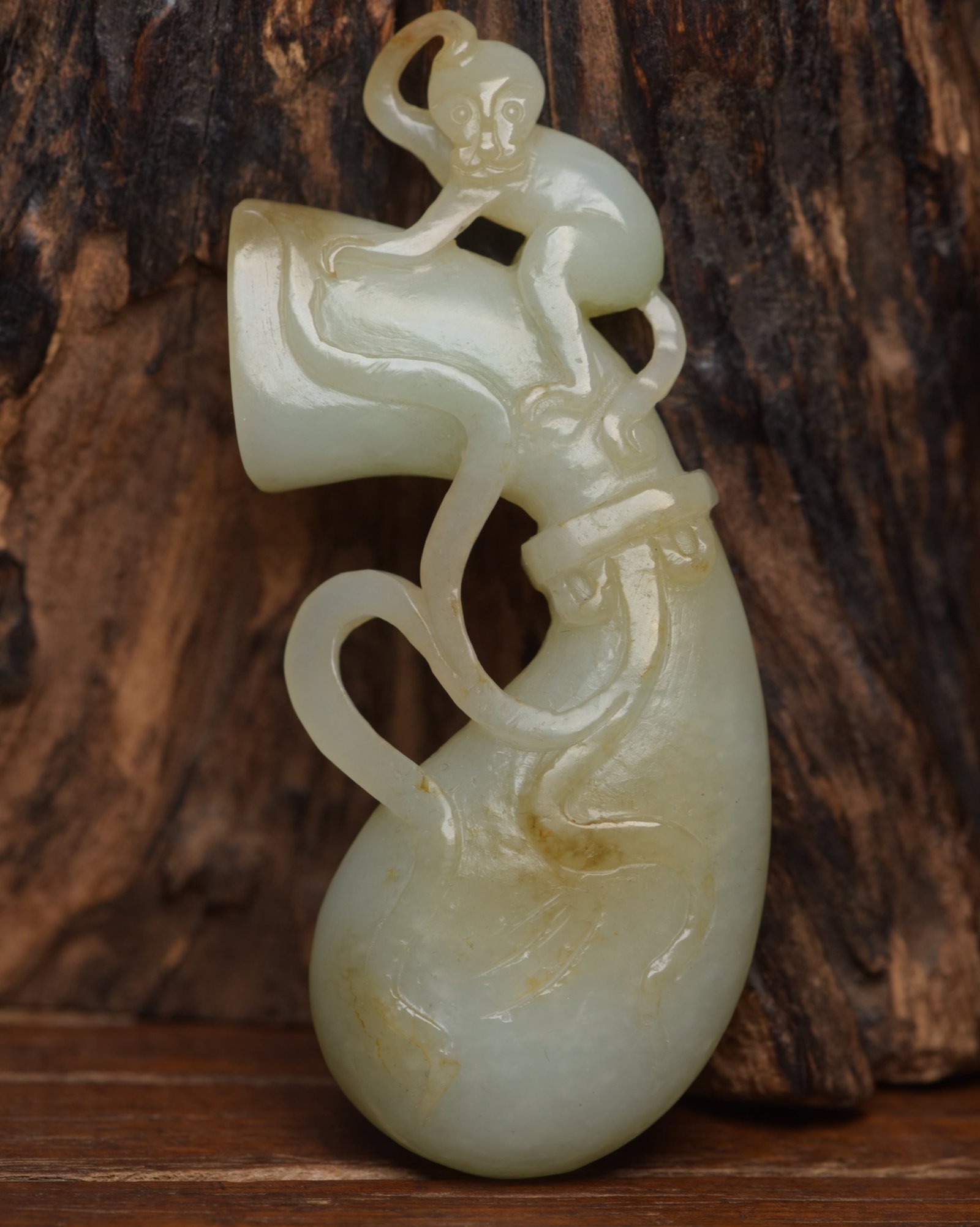 An Exquisite White Jade Monkey Ornament: An Exquisite White Jade Monkey Ornament,Qing Dynasty,China,Size:3.4inx1.4inx0.6in,Weight:57g 白玉猴子摆件,中国清代