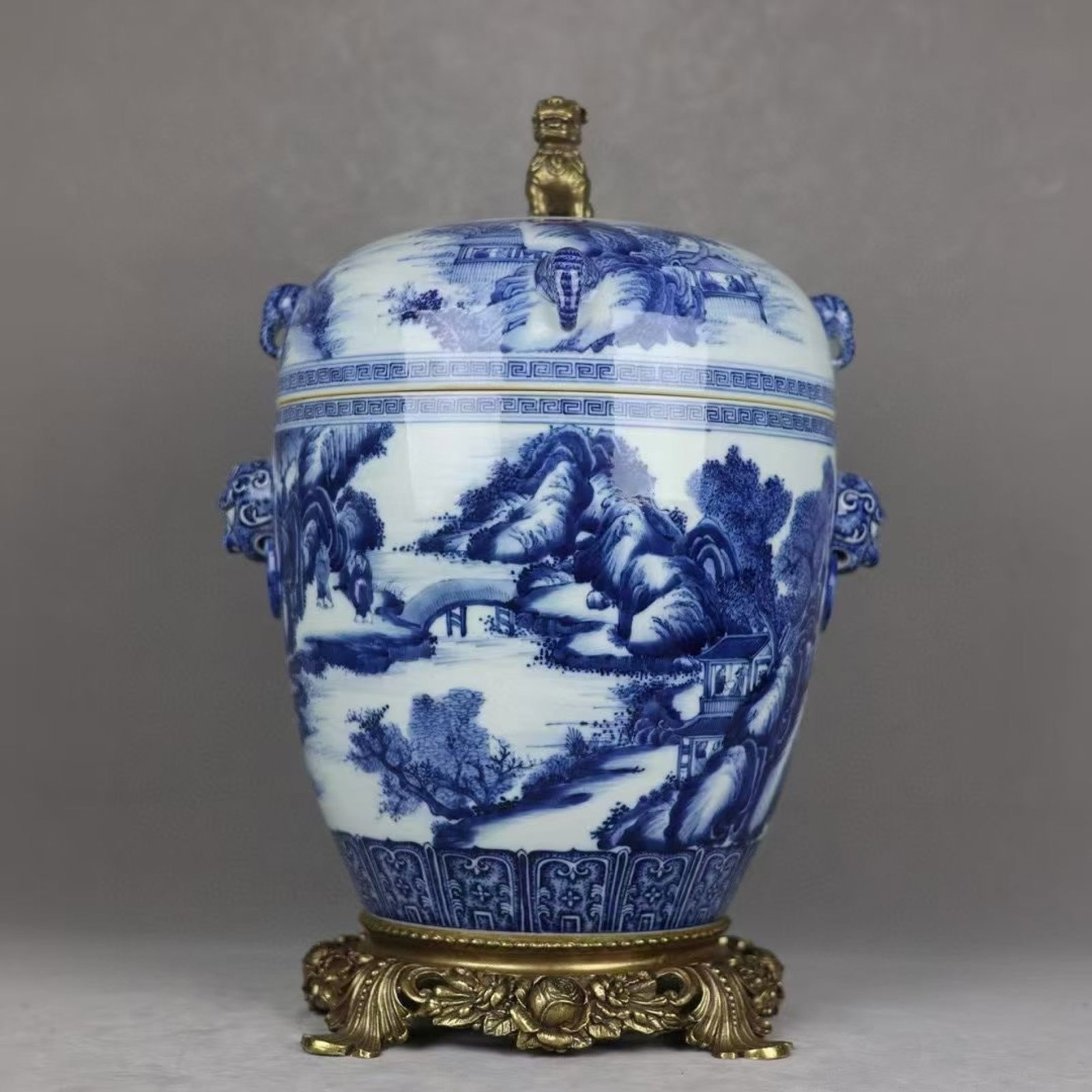 A Huge Blue and White Inlaid Bronze Landscape and Figure Pattern Beast-Ears Jar with Cover: A Huge Blue and White Inlaid Bronze Landscape and Figure Pattern Beast-Ears Jar with Cover,Qing Dynasty,China,Qianlong Six-Character Mark,Size:18.9inx12.6in 青花嵌铜山