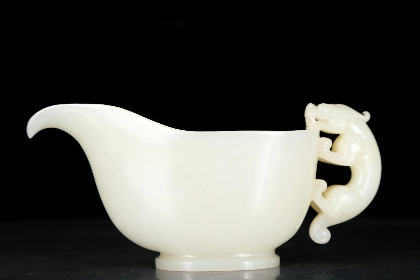 An exquisite white jade cup with auspicious animal patterns: An exquisite white jade cup with auspicious animal patterns, Qing Dynasty, China, Qianlong four-character mark, Size: 7.1inx2.6inx3.1in, Weight: 295g 清代 乾隆四字&