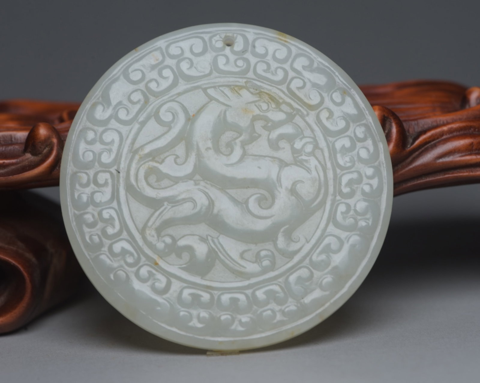 An Exquisite White Jade Dragon Pattern Pendant: An Exquisite White Jade Dragon Pattern Pendant,Qing Dynasty,China,Size:2.2inx2.2inx0.2in,Weight:32g 白玉龙纹牌,中国清代