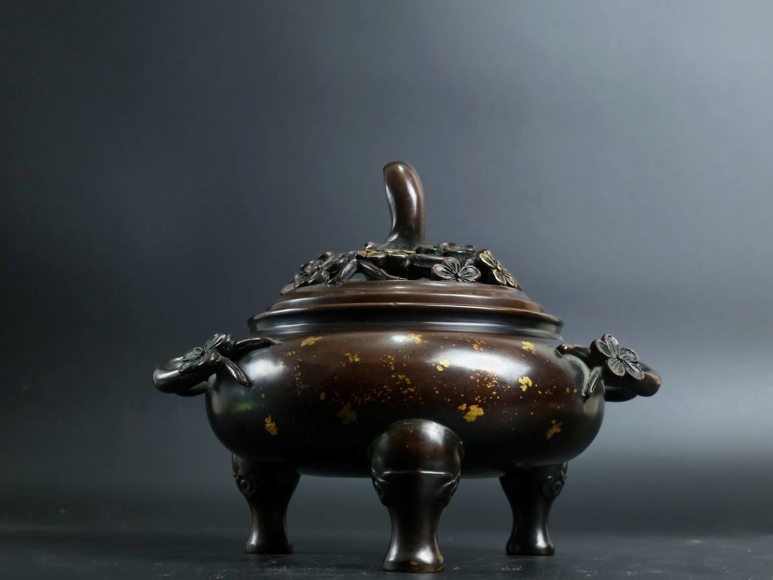 An Exquisite Gilt Bronze Plum Blossom Pattern Double-Ears and Tripod Censer: An Exquisite Gilt Bronze Plum Blossom Pattern Double-Ears and Tripod Censer,Ming Dynasty, China, Xuande Six-character Mark,Size:6.7inx5.4in,Weight:3835g