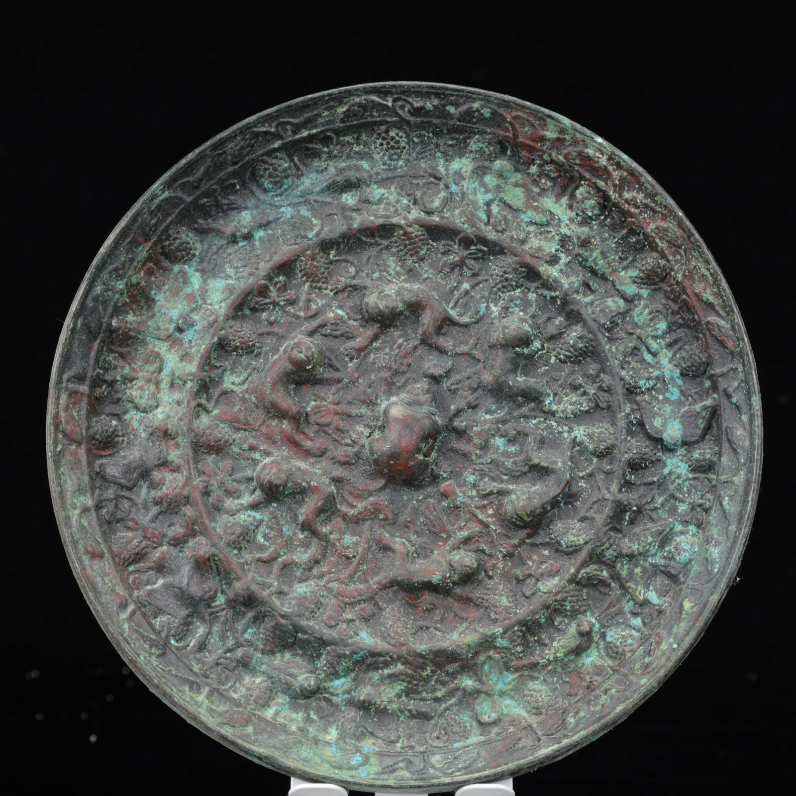 An Archaic Bronze Monkey Pattern Round Mirror: An Archaic Bronze Monkey Pattern Round Mirror,The Warring States period in China,Size:7.5inx0.6in,Weight:1350g 青铜猴纹圆镜,中国战国时