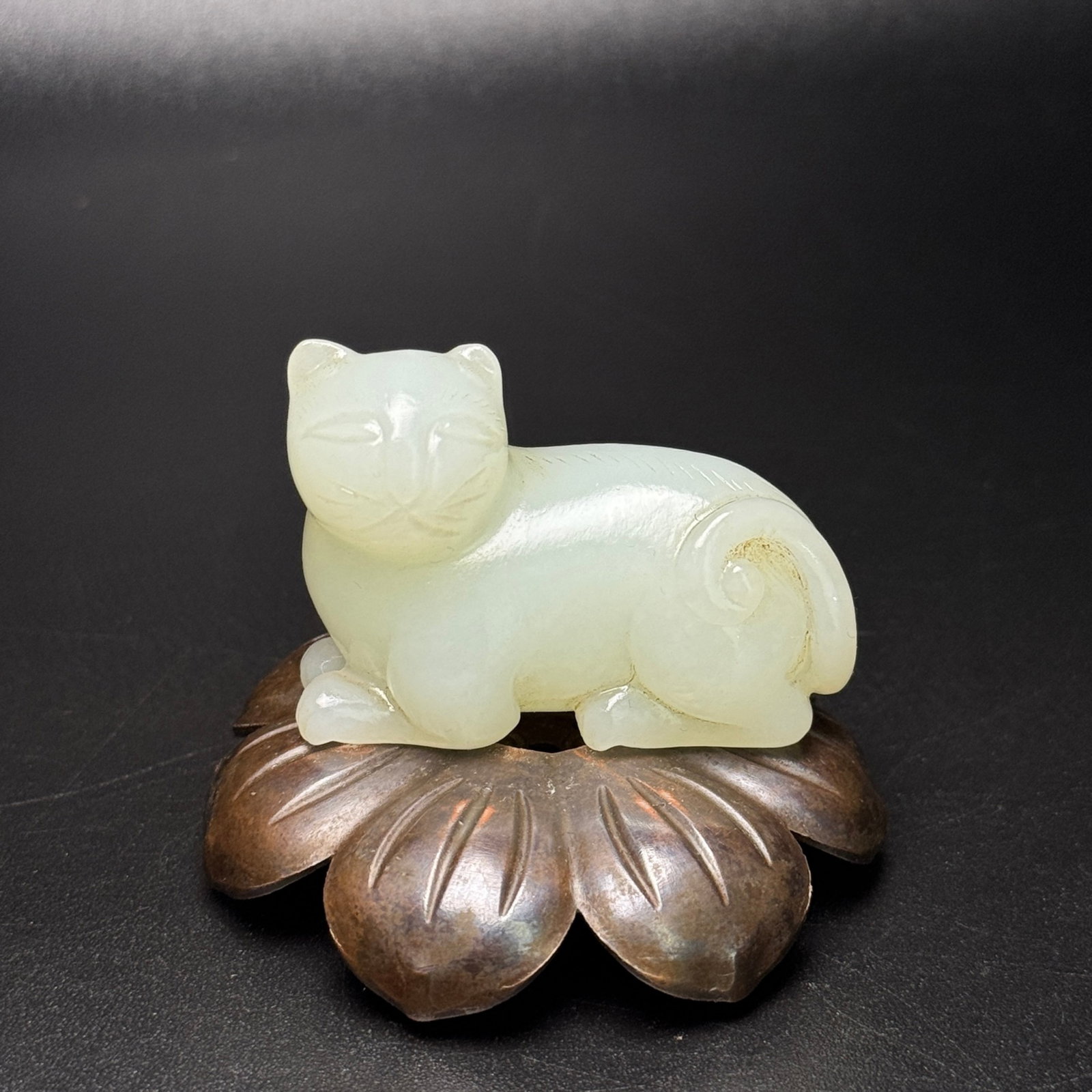 An Exquisite White Jade Cat Ornament: An Exquisite White Jade Cat Ornament,Qing Dynasty,China,Size:49mmx35mmx24mm,Weight:57g 白玉猫摆件,中国清代