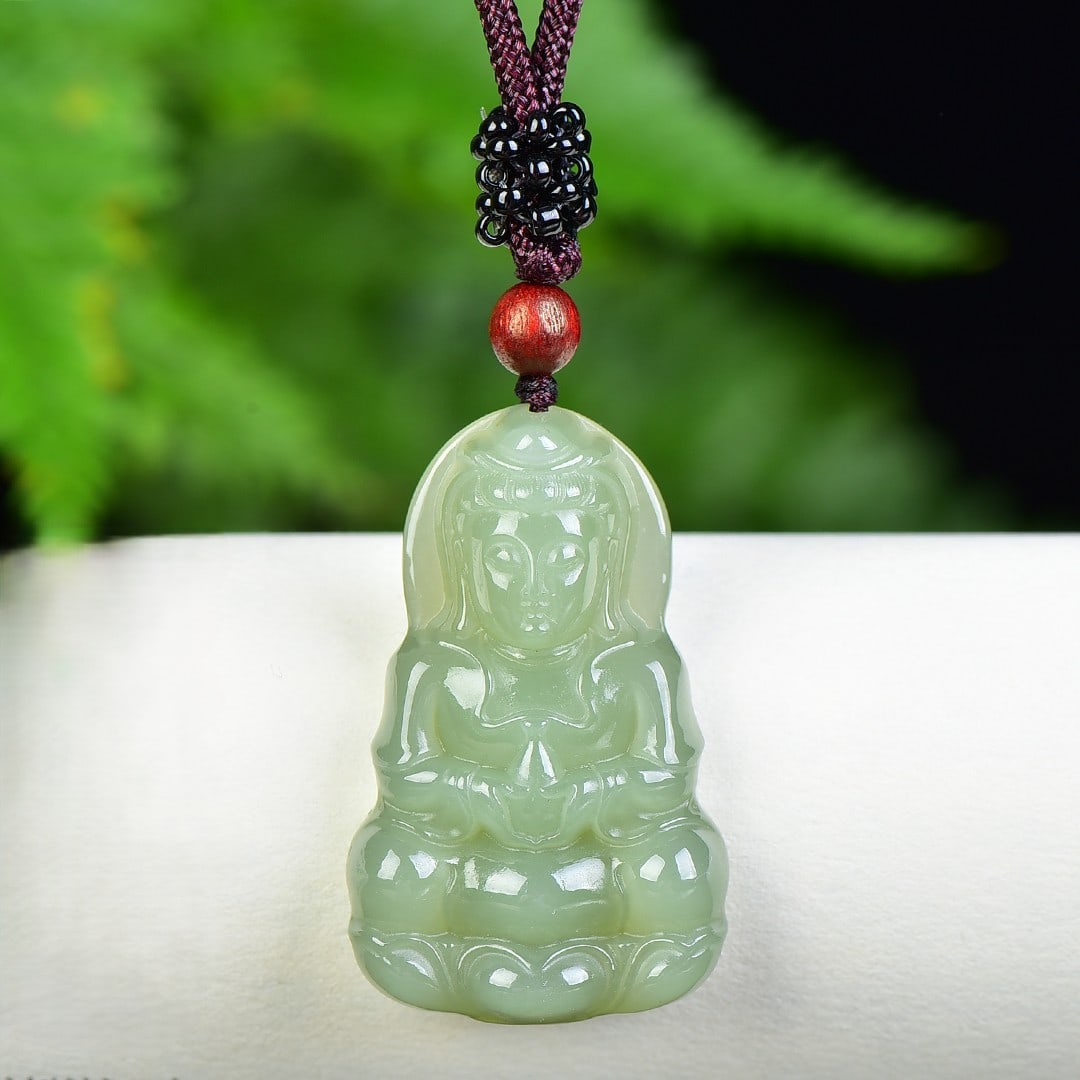 An Exquisite Greenish Jade Statue of Avalokitesvara Pendant: An Exquisite Greenish Jade Statue of Avalokitesvara Pendant,Size:26mmx42mm 青玉观音像挂件
