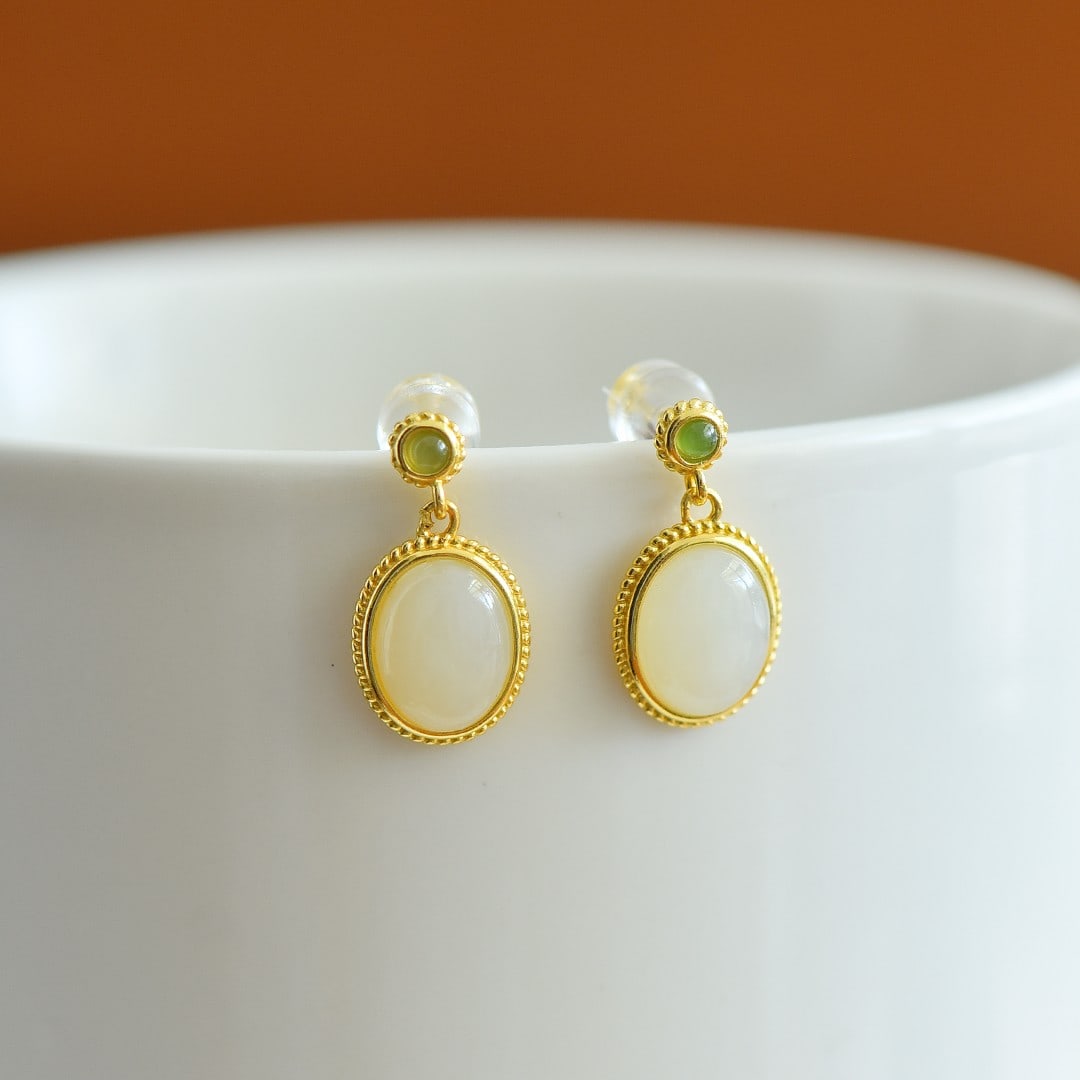 A Pair of Exquisite Sterling Silver-Gold Plated Inlaid White Jade Earrings: A Pair of Exquisite Sterling Silver-Gold Plated Inlaid White Jade Earrings,Size:8mmx10mm 一对纯银镀金镶白玉耳环