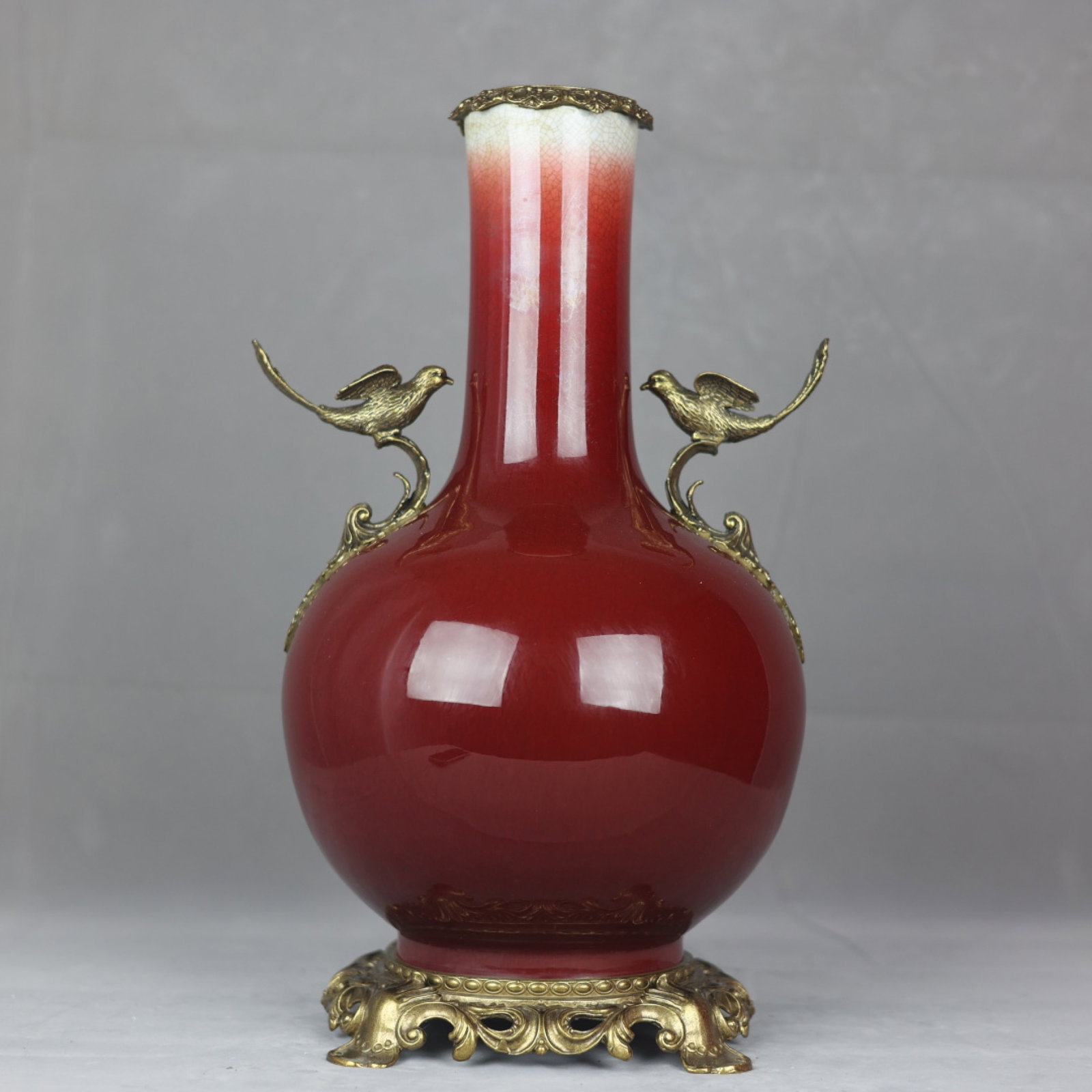 A Huge Red Glazed Inlaid Bronze Bird Pattern Double-Ears Vase: A Huge Red Glazed Inlaid Bronze Bird Pattern Double-Ears Vase,Qing Dynasty,China,Qianlong Six-Character Mark,Size:18.1inx10.2in 红釉嵌铜鸟纹双耳瓶