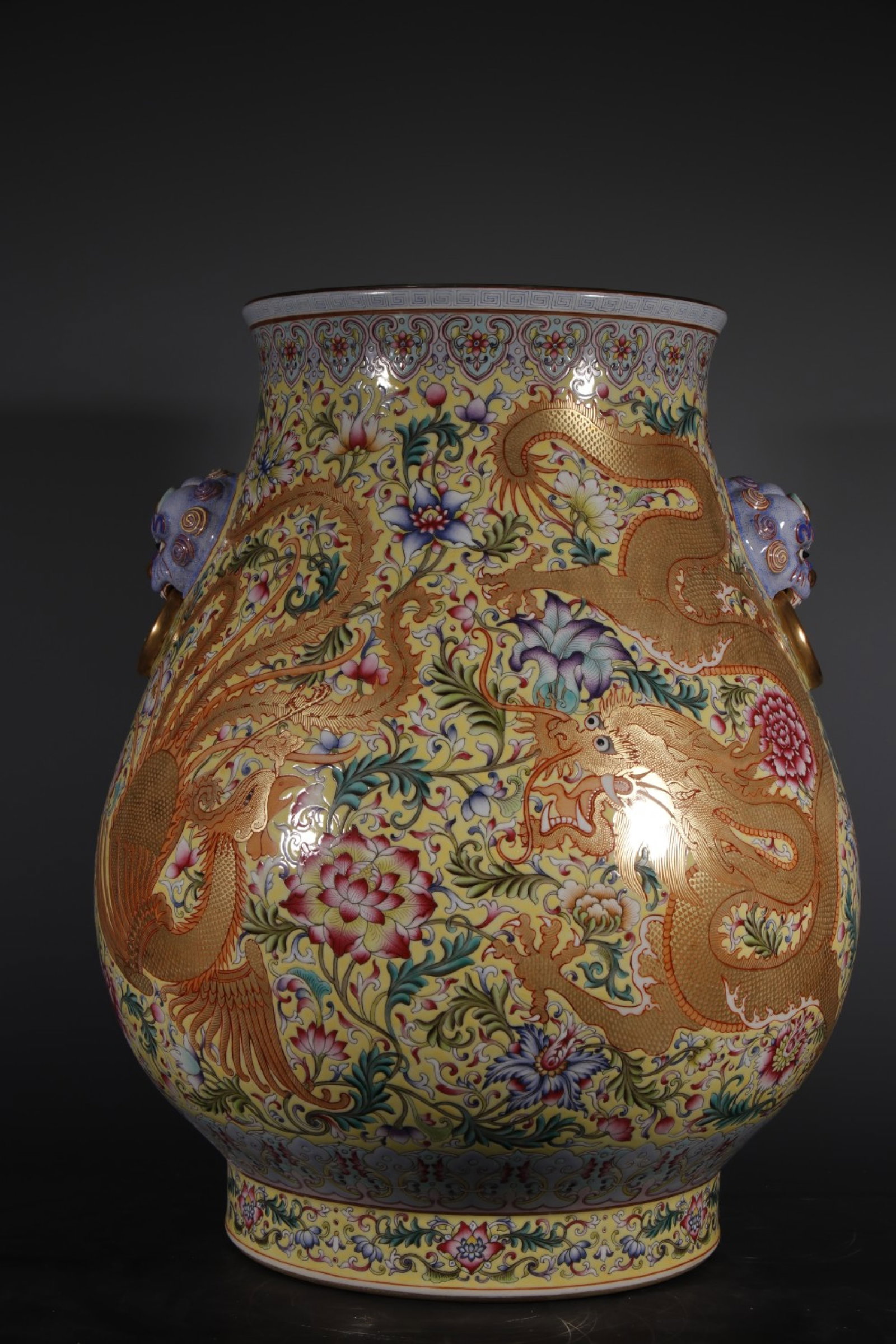 An Exquisite Enamel Yellow Ground Dragon and Phoenix Pattern Lion-Ears Vase: An Exquisite Enamel Yellow Ground Dragon and Phoenix Pattern Lion-Ears Vase,Qing Dynasty,China,Qianlong Four-character Mark,Size:18.5inx9.6in 珐琅彩黄地龙凤&#