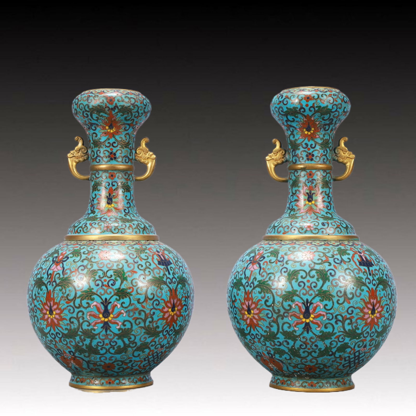 A Pair of Exquisite Cloisonne Lotus Pattern Double-Ears Vases: A Pair of Exquisite Cloisonne Lotus Pattern Double-Ears Vases,Qing Dynasty,China,Qianlong Four-character Mark,Size:6.5inx10.4in,Total Weight:2350g 一对景泰蓝缠ĉ
