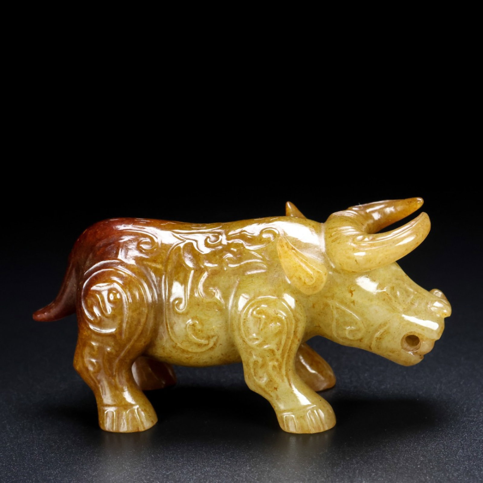 An Archaic Gaogu yu Buffalo Ornament: An Archaic Gaogu yu Buffalo Ornament,Ancient Time, China, Size:3.5inx1.4inx1.6in, Weight:161g 高古玉牛摆件,中国远古时期,