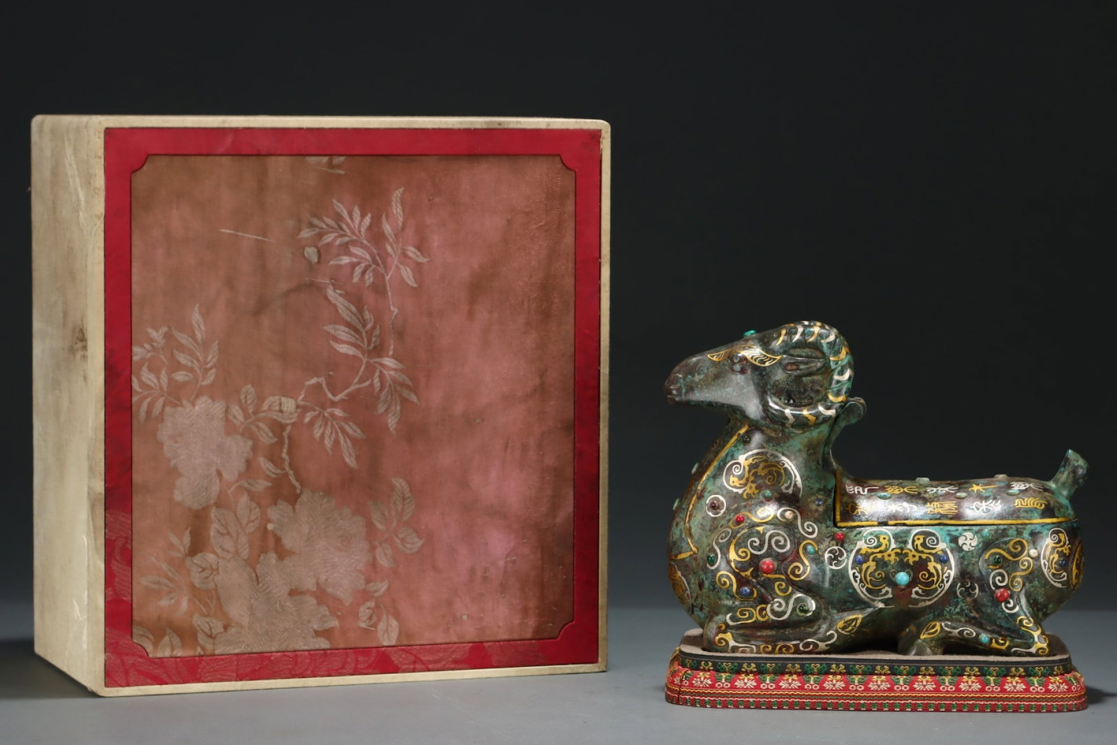 An Exquisite Bronze Inlaid Gold and Silver Sheep Ornament,with Inscription,Inlaid Gems: An Exquisite Bronze Inlaid Gold and Silver Sheep Ornament,with Inscription,Inlaid Gems,Size:7.7inx9.8in,Qing Dynasty,China 铜错金银羊摆件,带铭