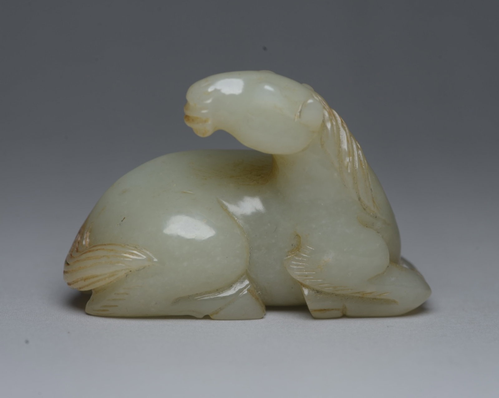 An Exquisite White Jade Horse Ornament: An Exquisite White Jade Horse Ornament,Qing Dynasty,China,Size:2.4inx1.6inx1.1in,Weight:82g 白玉骏马摆件,中国清代