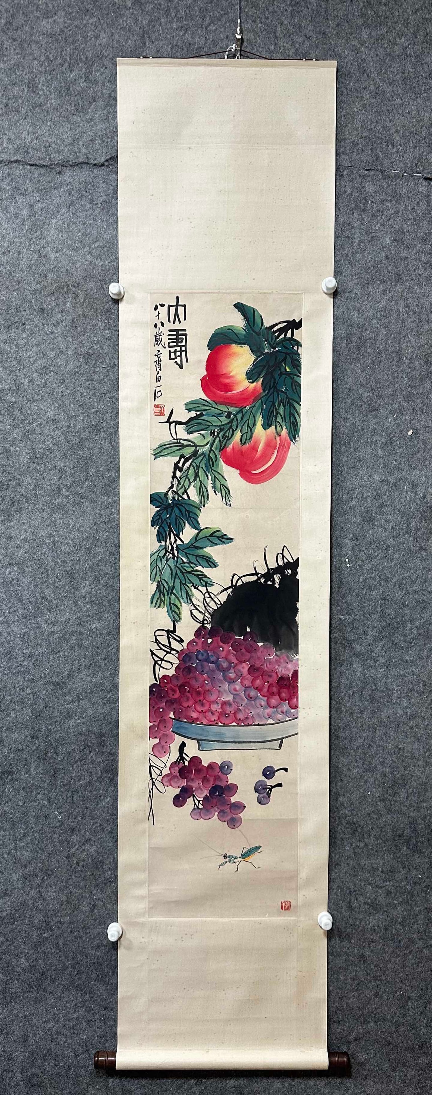 A Chinese Vertical Scroll Ink Painting of Grapes on Paper: A Chinese Vertical Scroll Ink Painting of Grapes on Paper,Qi Baishi,Size:13.4inx55.1in 一幅中国水墨葡萄画立轴,齐白石