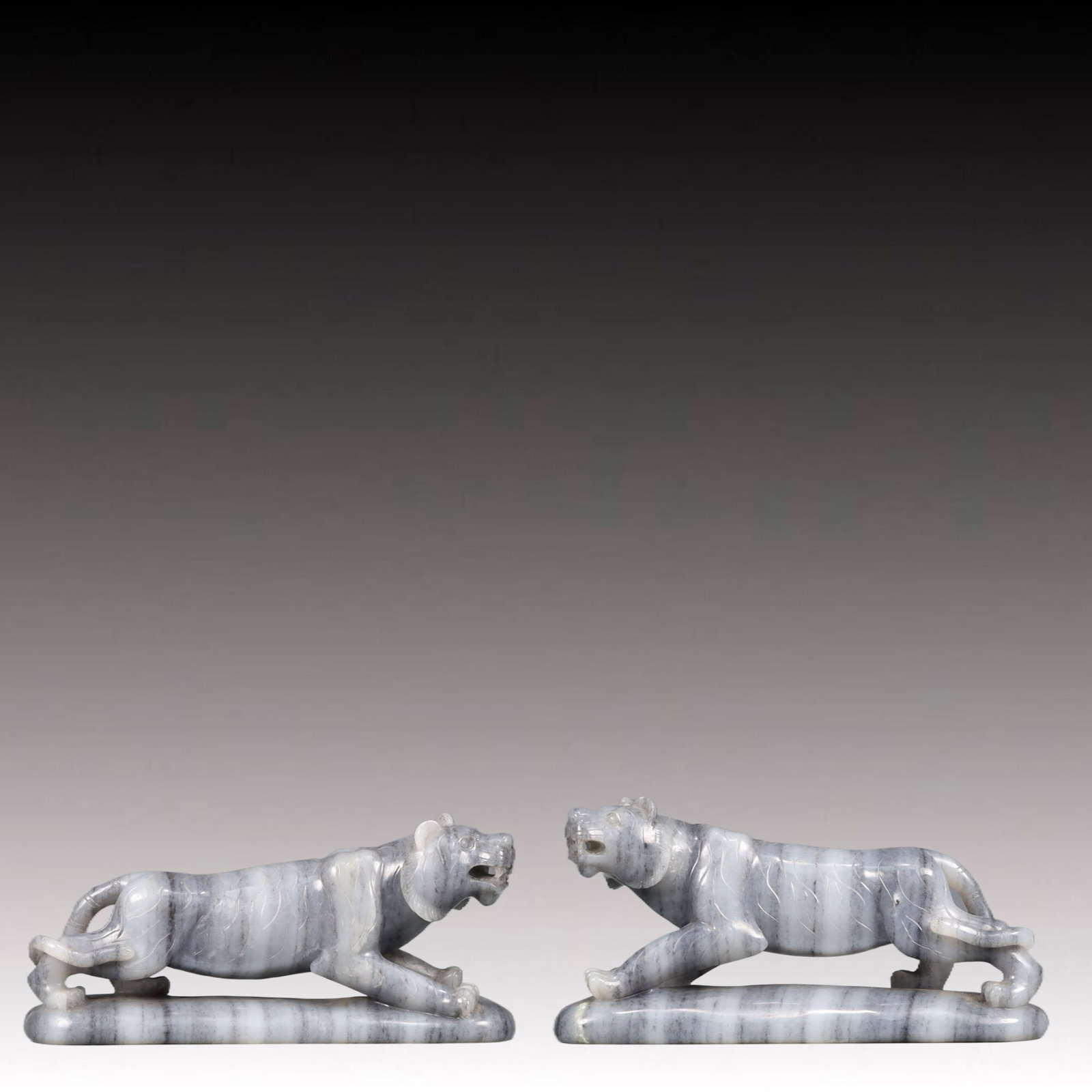 A Pair of Exquisite Cyan jade Tiger Ornaments: A Pair of Exquisite Cyan jade Tiger Ornaments,Qing Dynasty, China,Size:6.3inx2inx3in Weight:1150g 一对青玉老虎摆件,中国清代