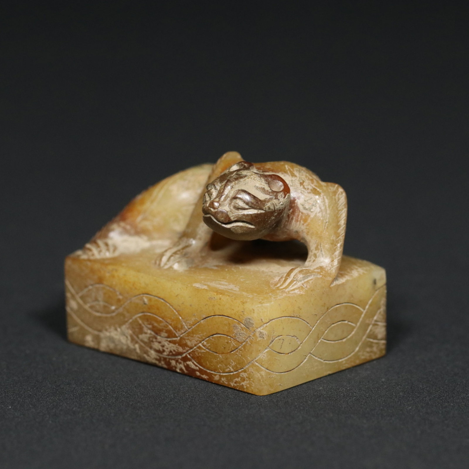 An Exquisite Archaic Jade Tiger Seal (1 of 9)